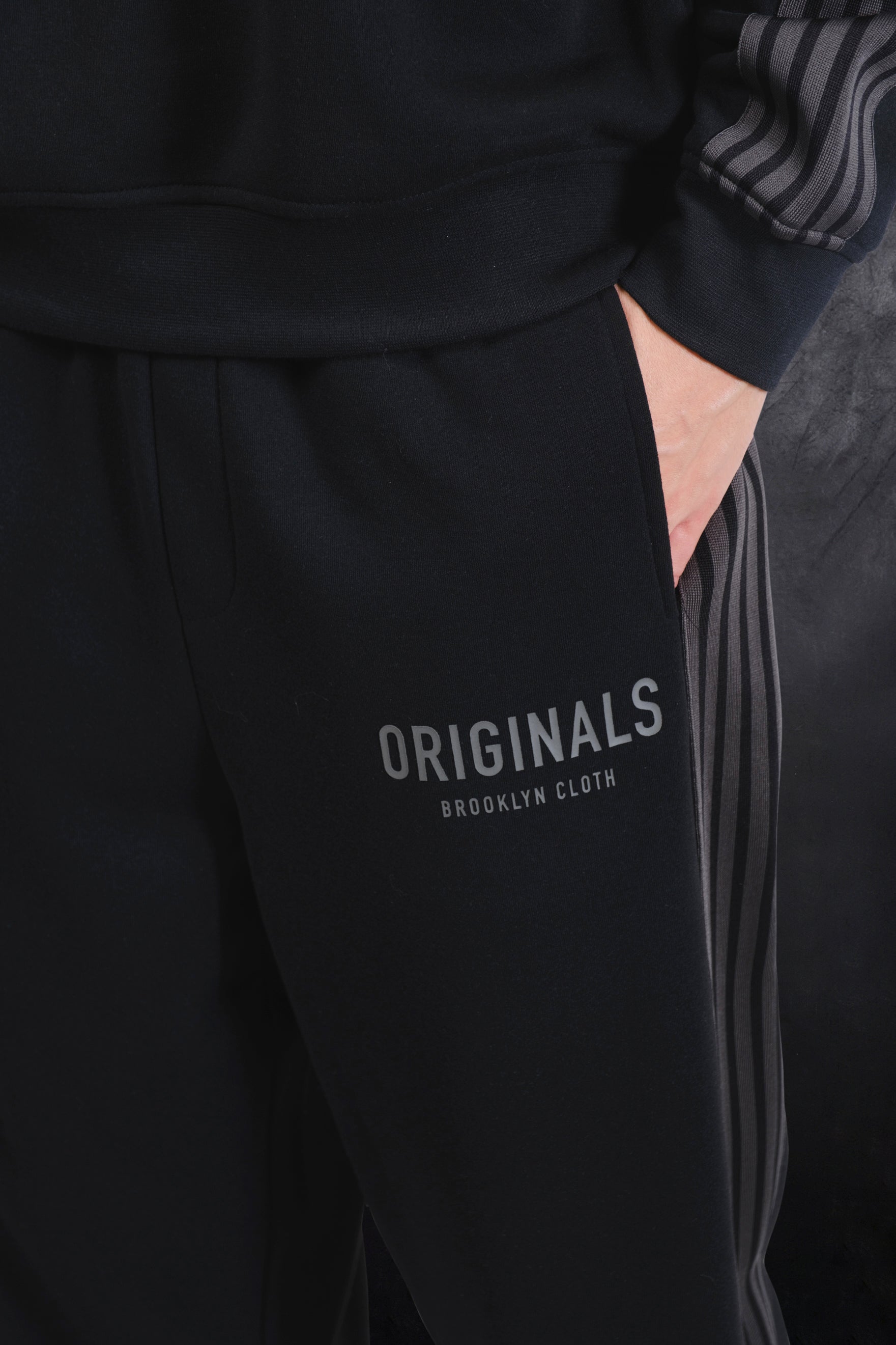Black track pant made with cozy fleece and a drawstring waist
#color_black