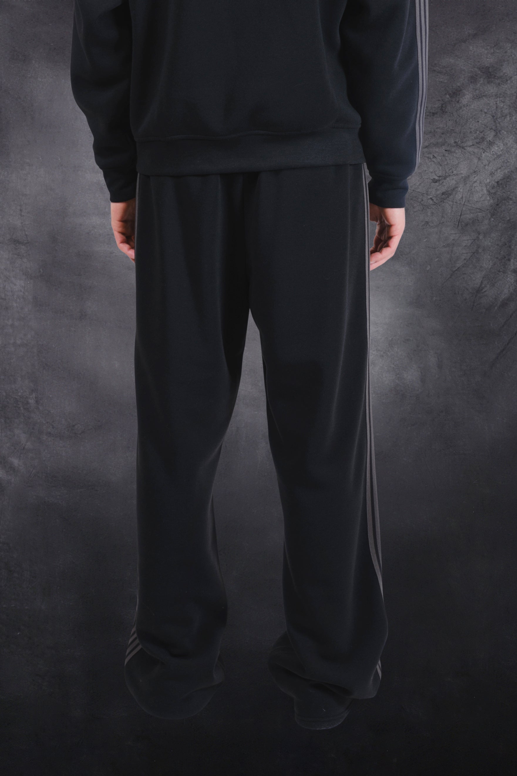 Men's cozy fleece track pant with a loose fit and drawstring waist for comfort
#color_black