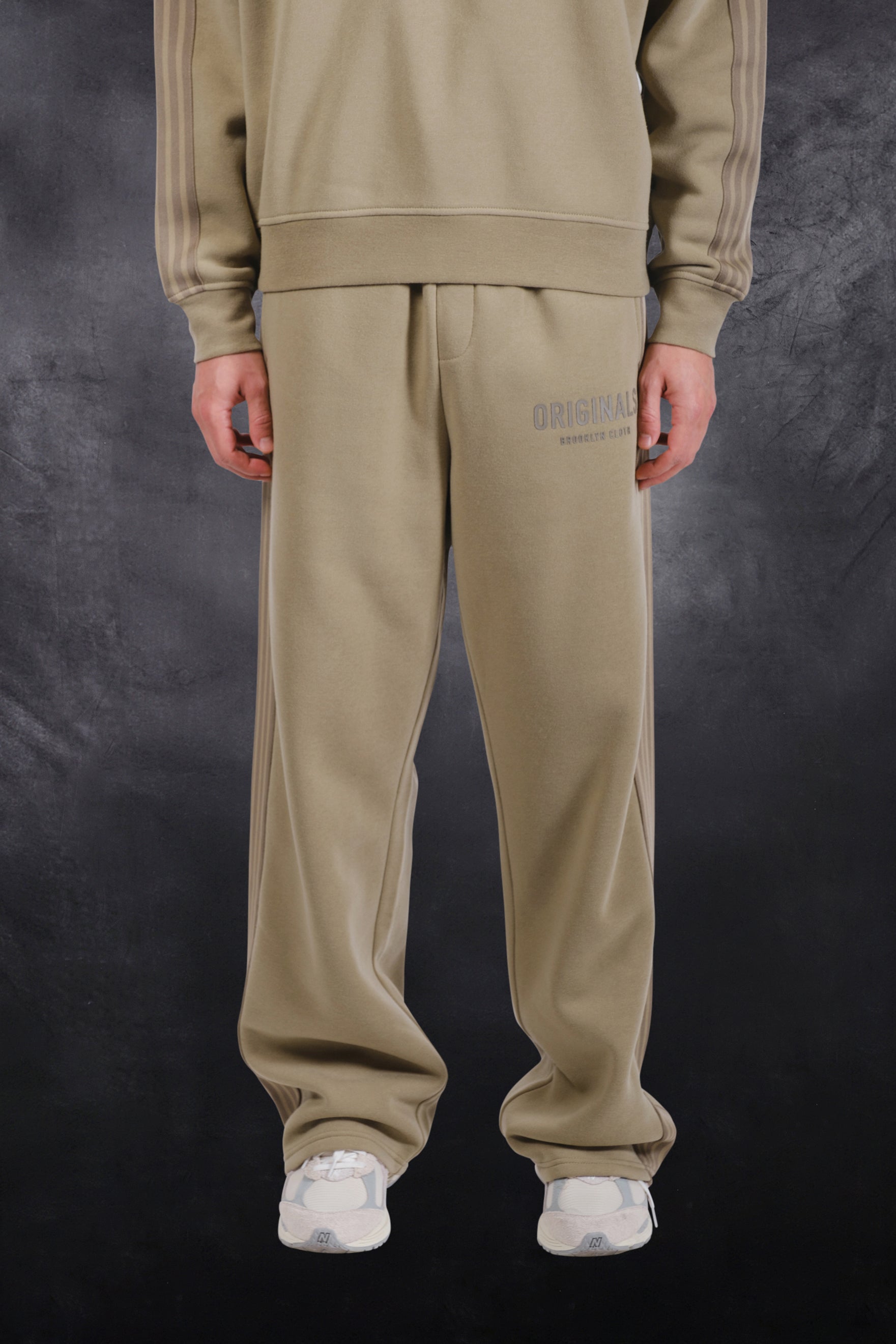 Men's cozy fleece track pant with a loose fit and drawstring waist for comfort
#color_olive green