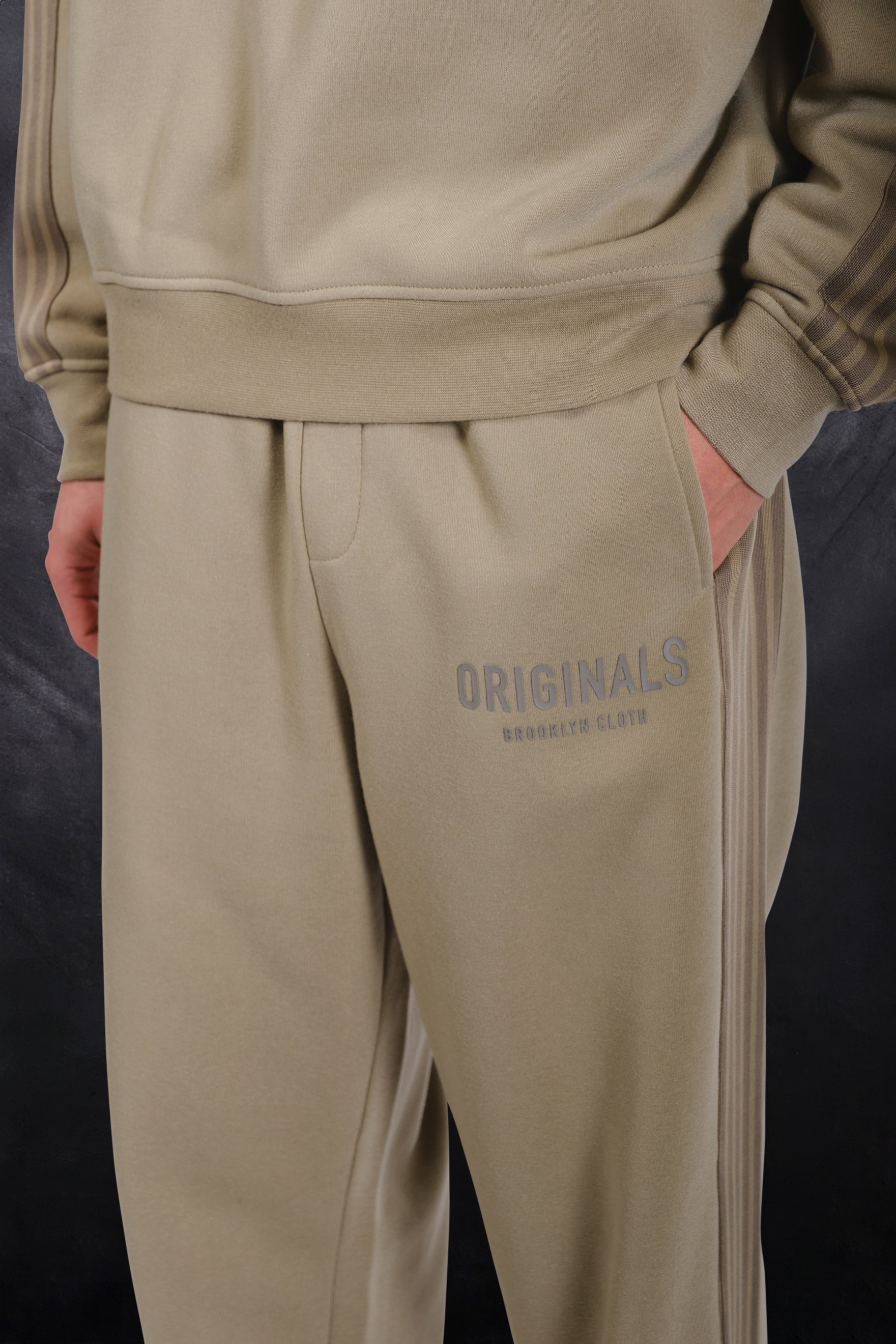 Men's cozy fleece track pant with a loose fit and drawstring waist for comfort
#color_olive green