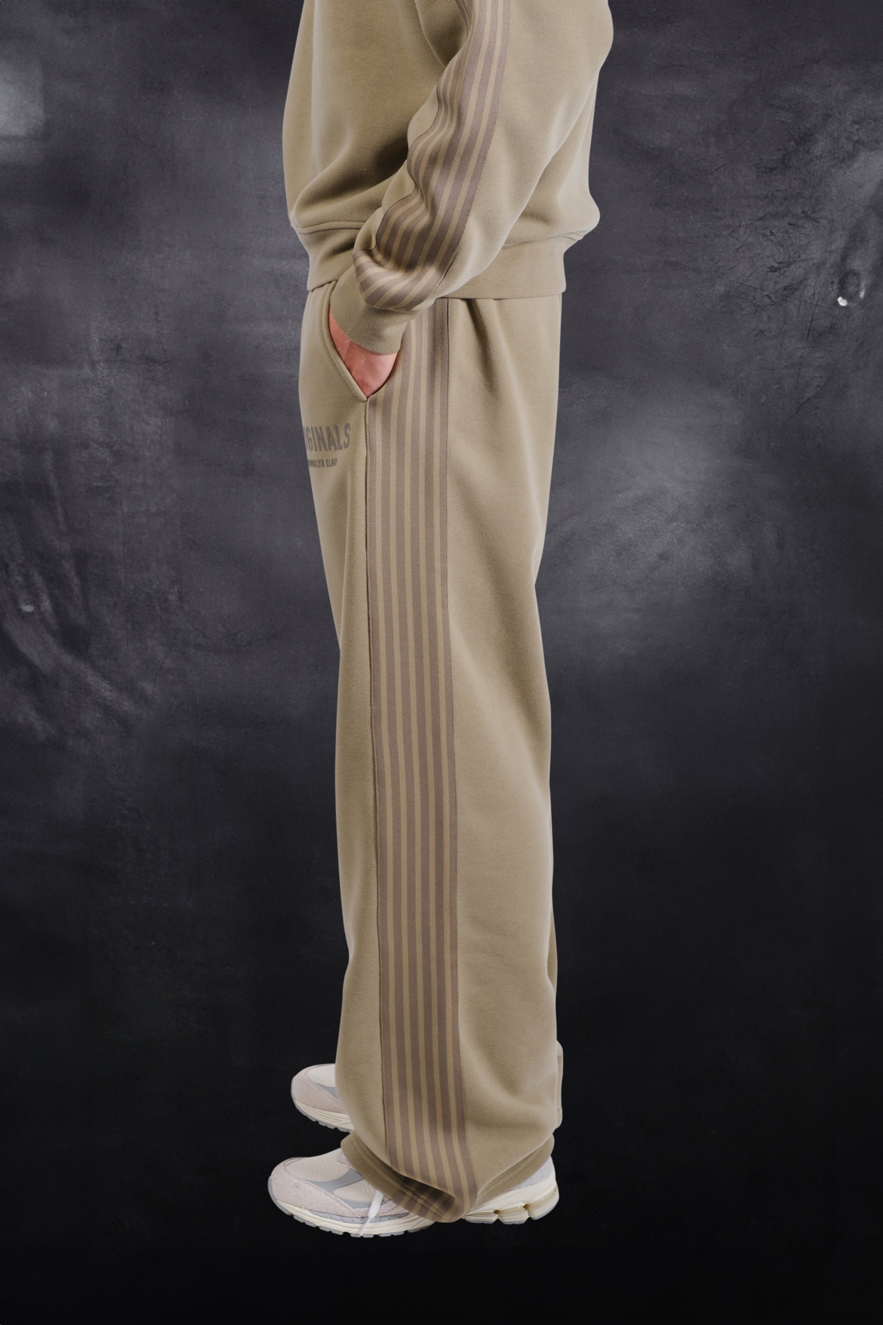 Loose fit track pant with warm fleece material and drawstring waist for comfort #color_olive green