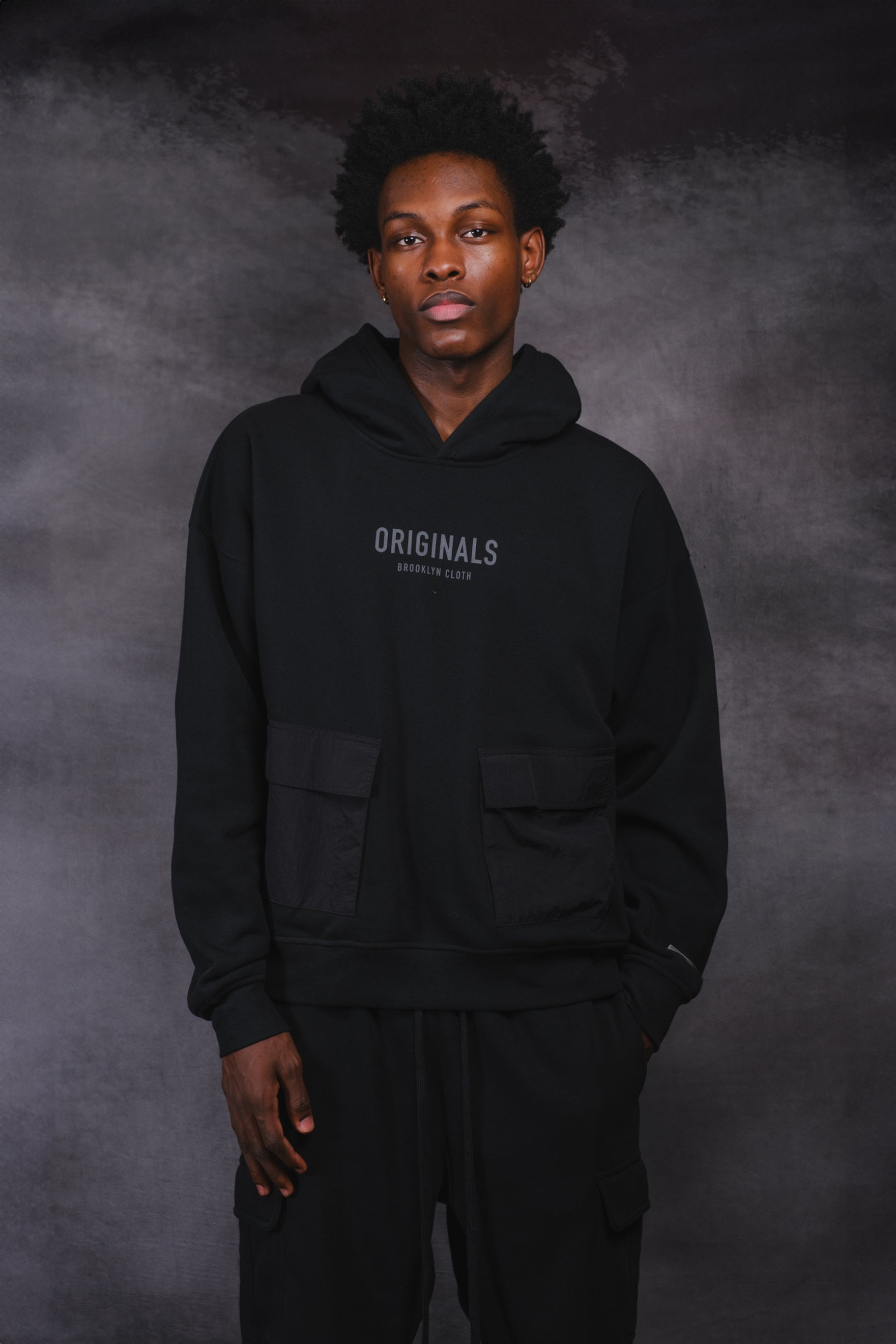 Originals Nylon Cargo Pocket Hoodie. #color_black