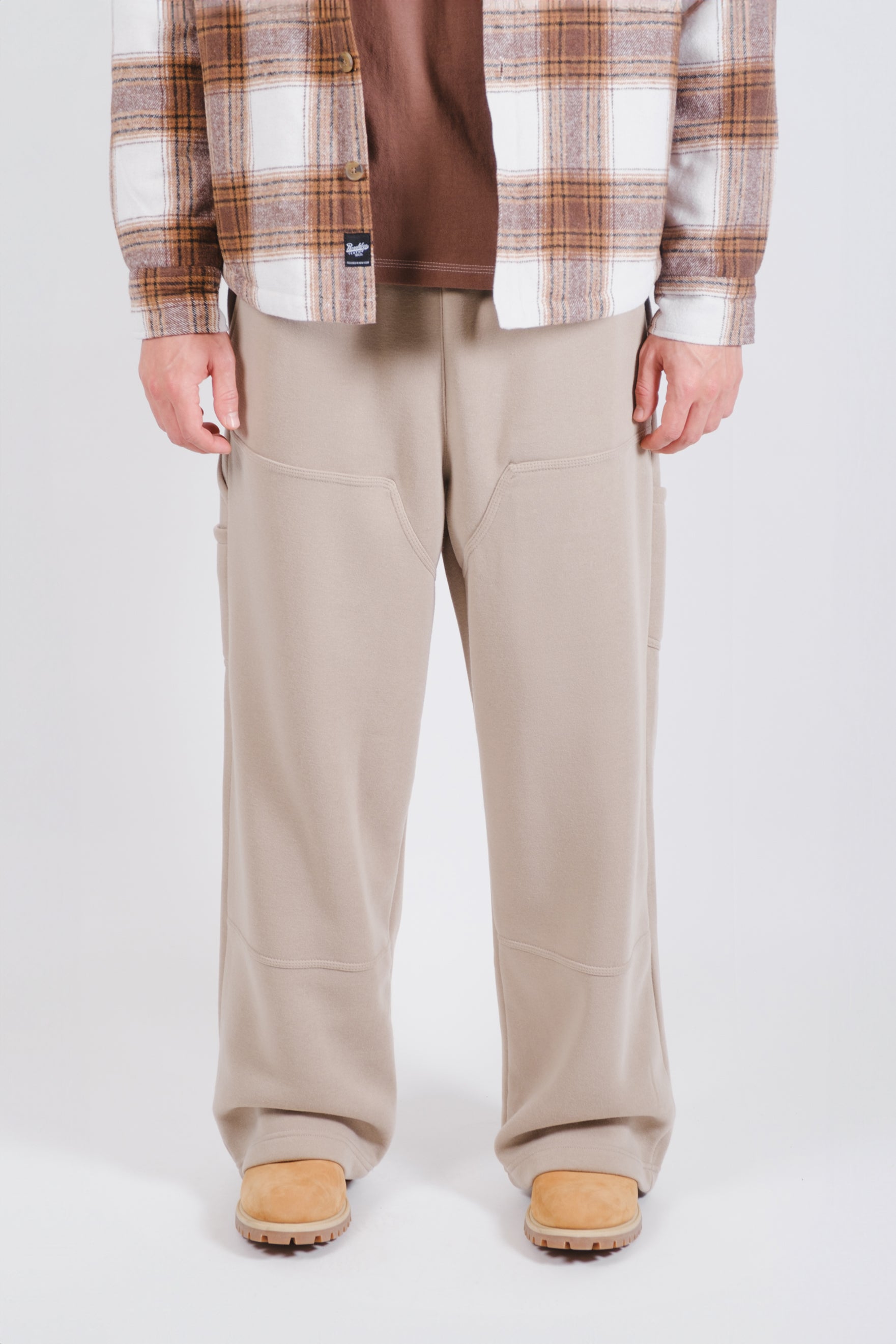Men's fleece carpenter pants with durable side pockets for everyday wear
#color_pumice stone