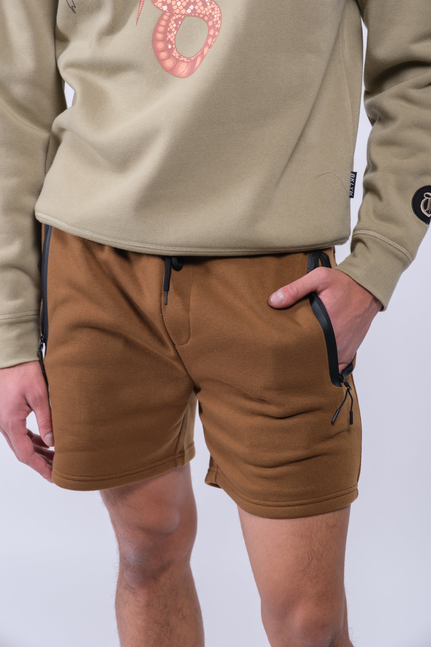 Comfortable 5 inch inseam shorts featuring sleek design and zip pocket
#color_toffee