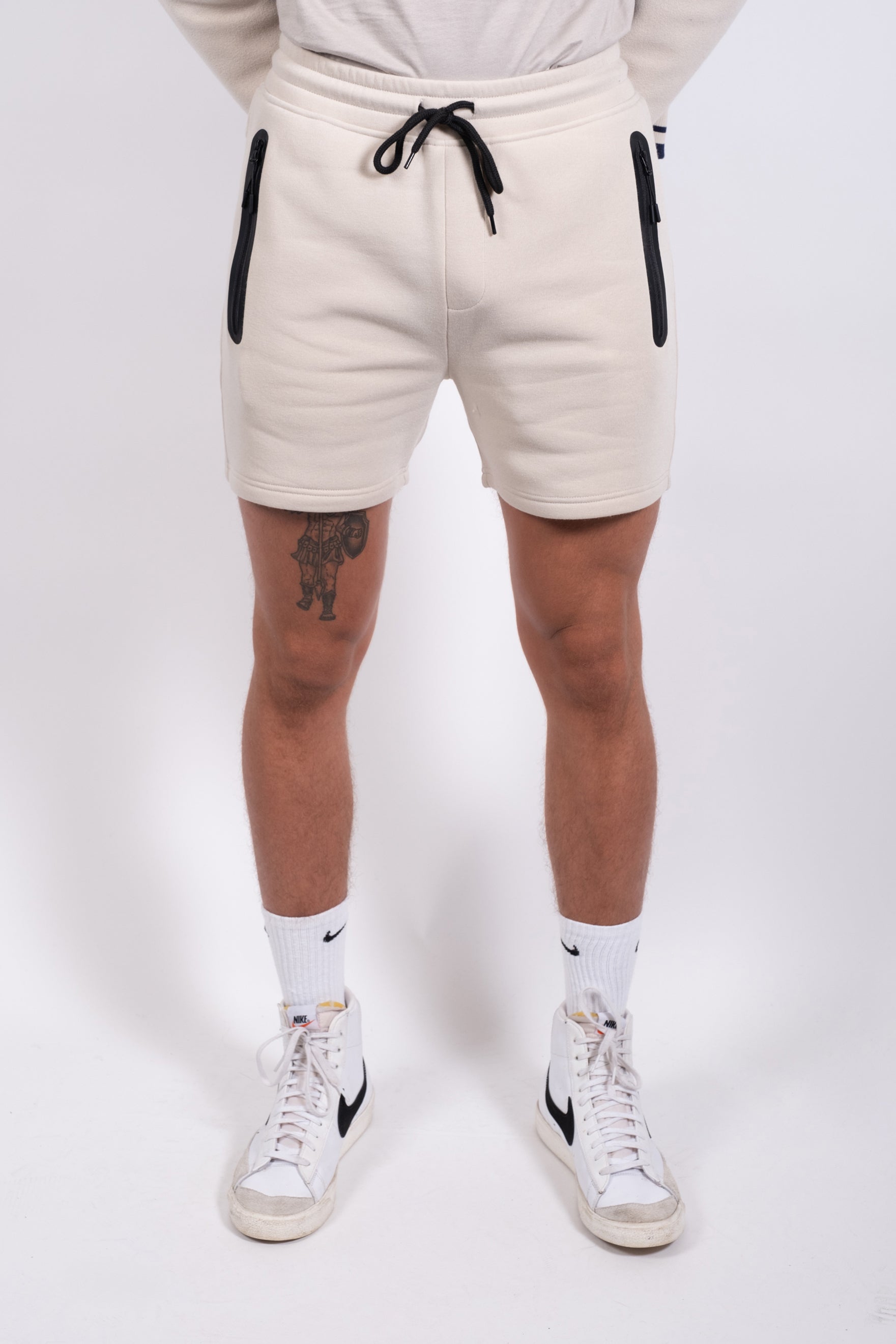 Men's 5 inch inseam Heat Seal Zip Pocket Short designed for flexibility
#color_sand