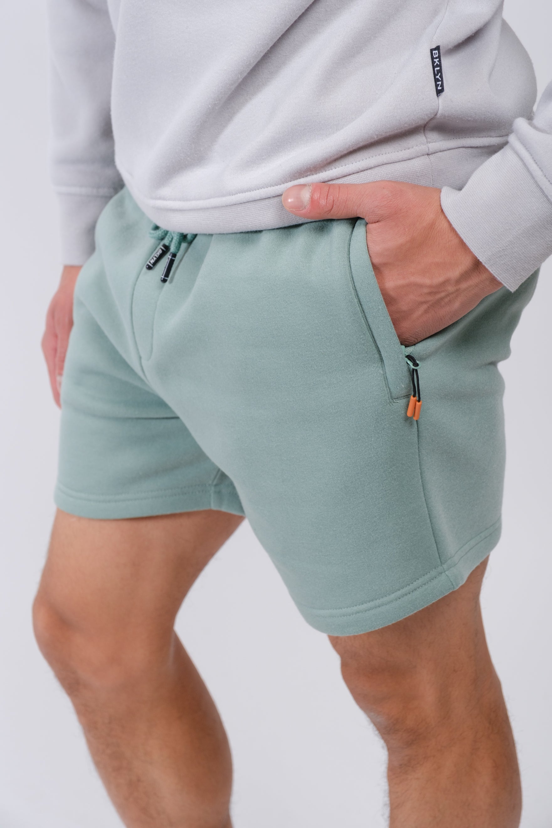 5 inseam men’s fleece shorts with zip pocket for convenience
#color_soft moss