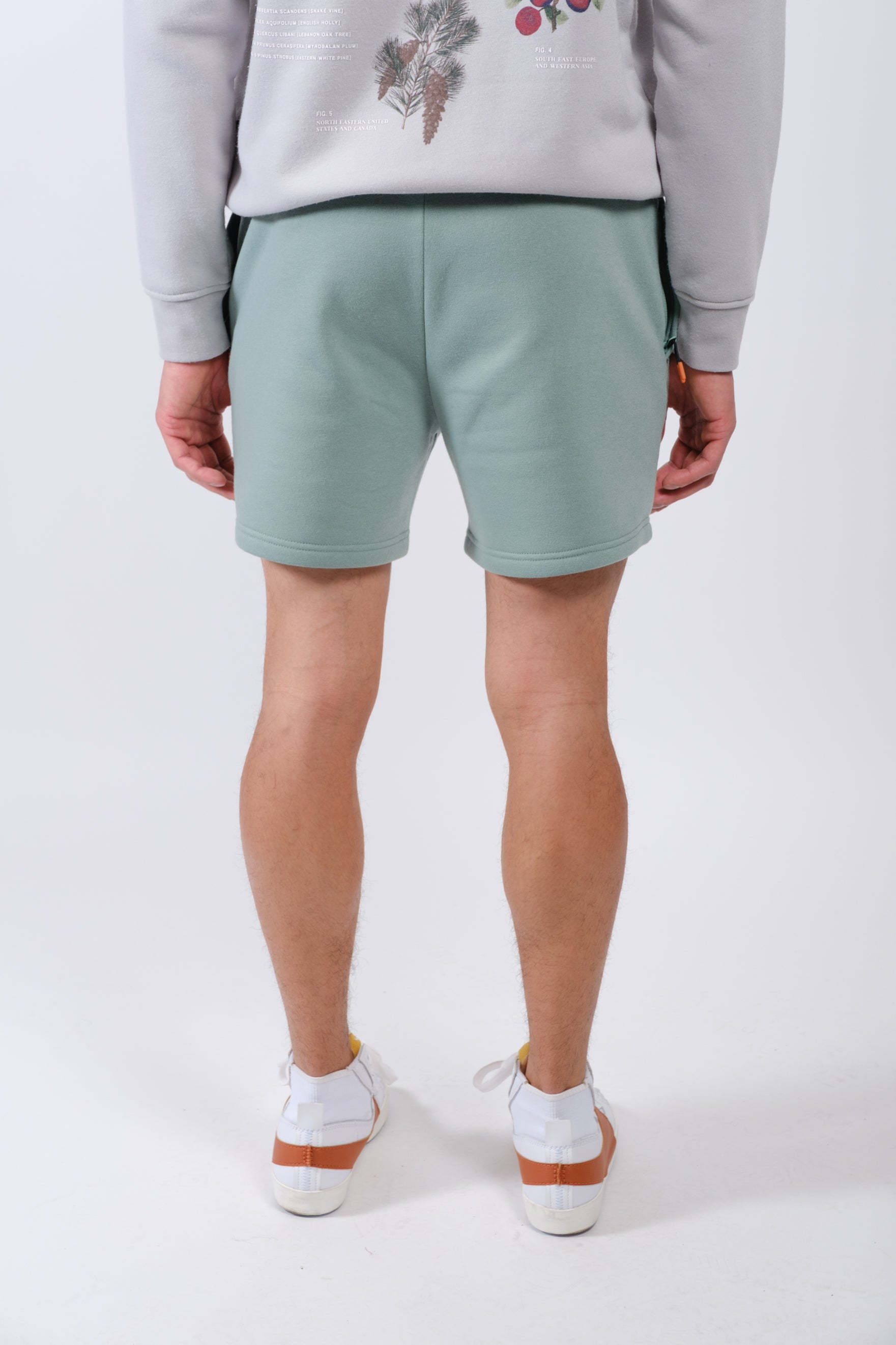 Men’s fleece shorts with trendy 5 inseam and functional zip pocket
#color_soft moss
