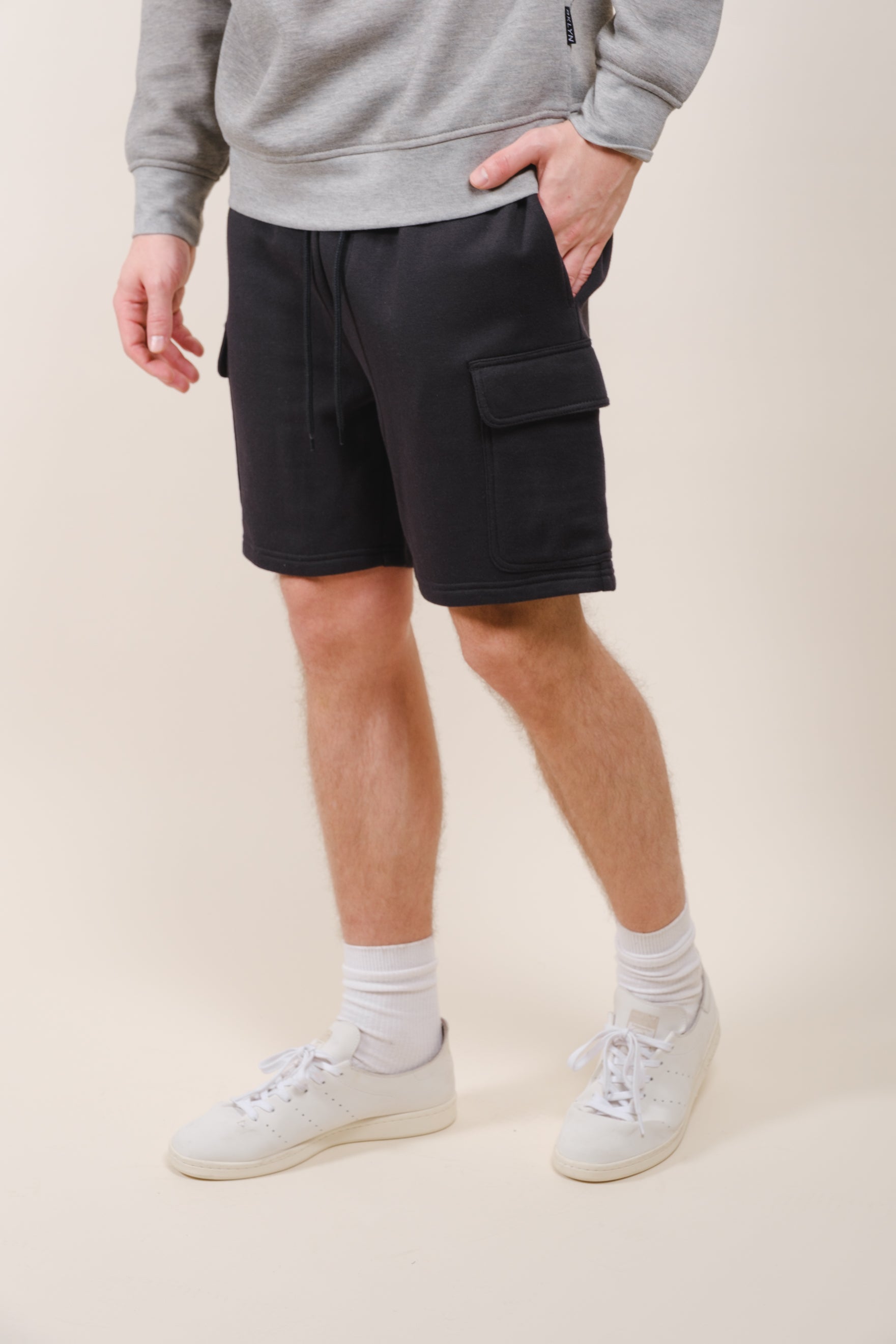Men's versatile cargo shorts with 7 inch inseam and soft fleece
#color_black