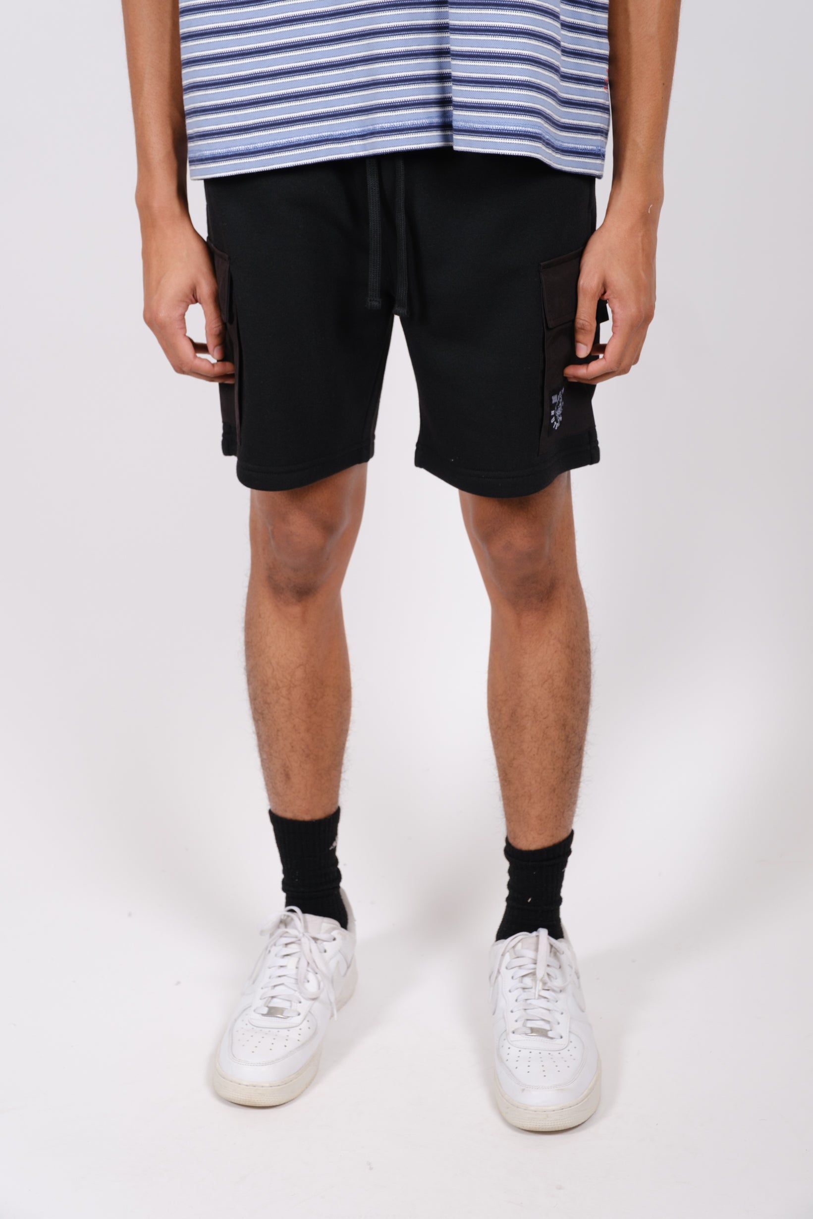 Men's 7 inch fleece shorts featuring side nylon pocket
#color_black