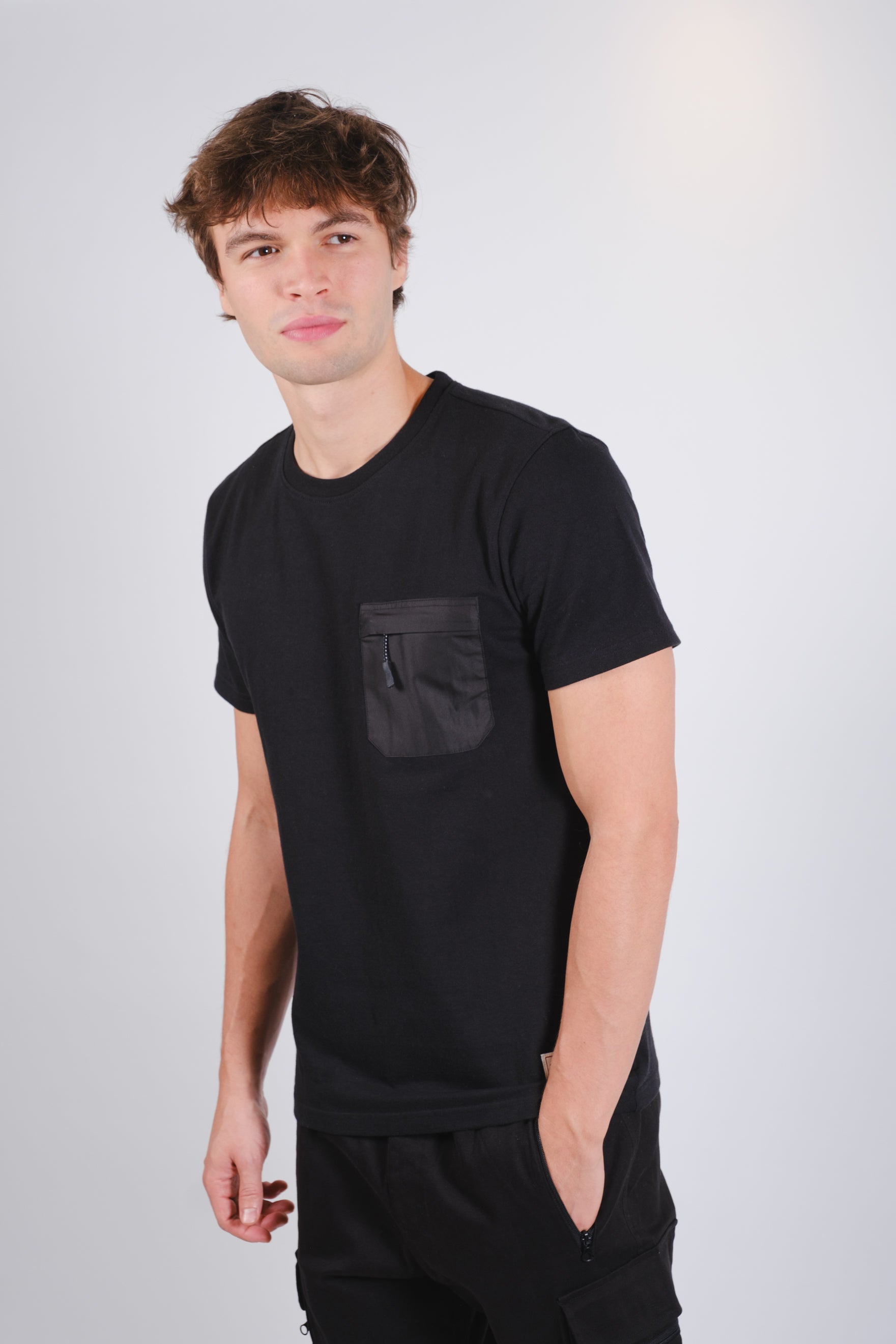 Short sleeve nylon tee with zippered chest pocket and classic fit
#color_black