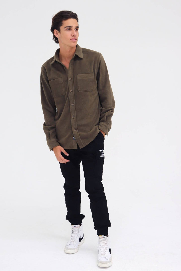 Heavy knit shacket with a classic fit
#color_olive