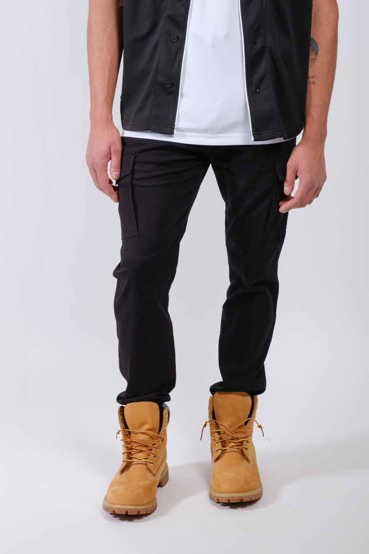 Twill joggers with cargo pockets and elastic ankle cuffs for casual men’s style
#color_black