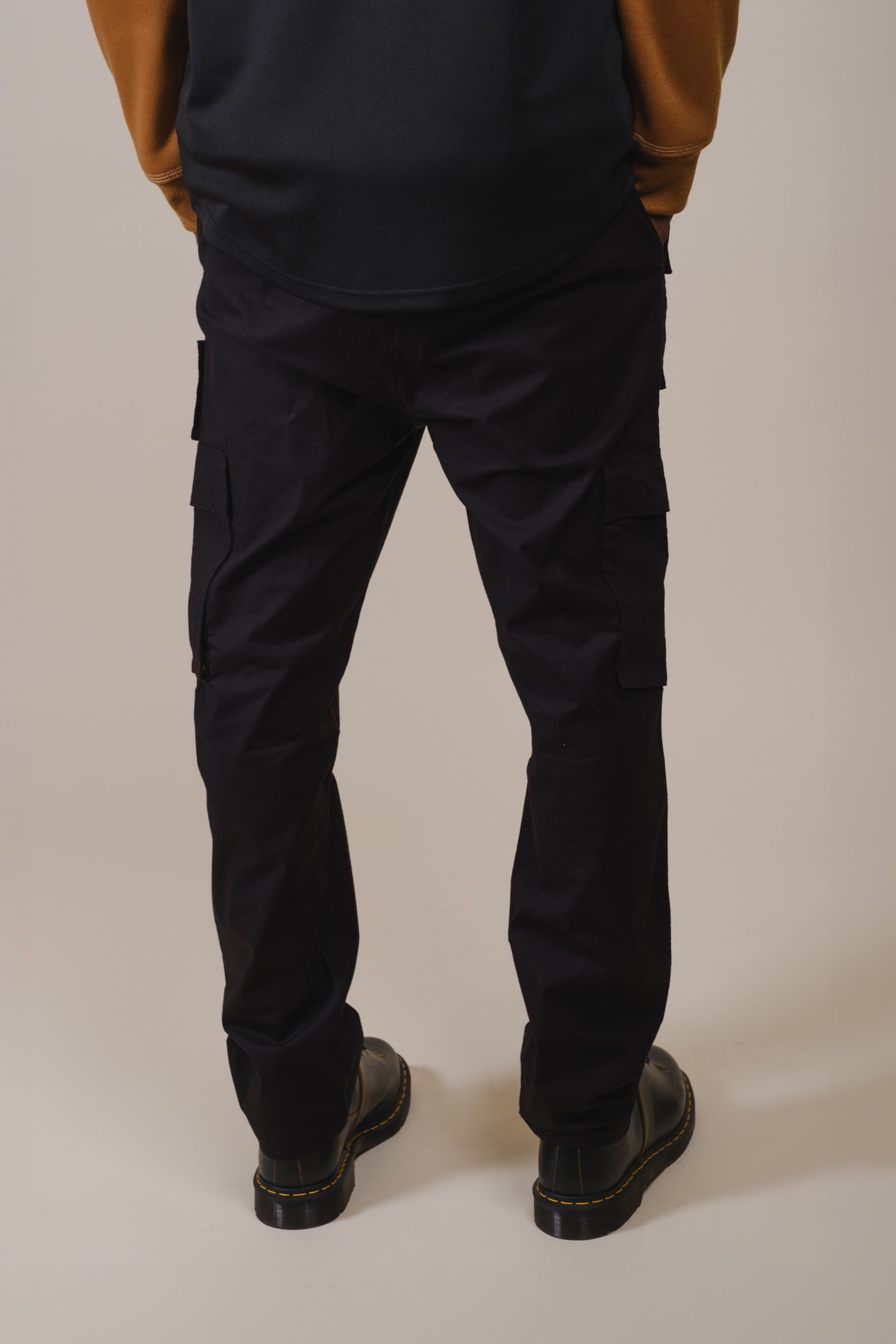 Multi pocket poplin cargo pants for men with casual utility style and drawstring waist
#color_black