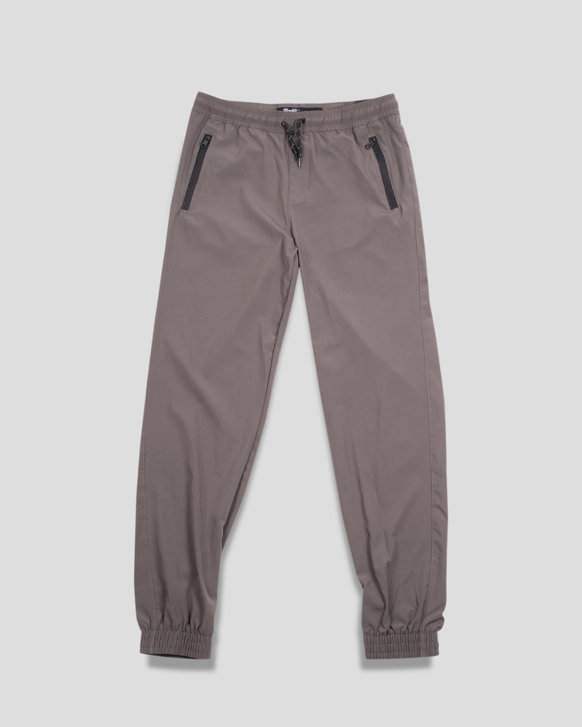 Kids 4-Way Stretch Zip Pocket Jogger
Kids tobacco joggers, 4-way stretch, zip pocket jogger, with drawstring for adjustable waist. #color_charcoal