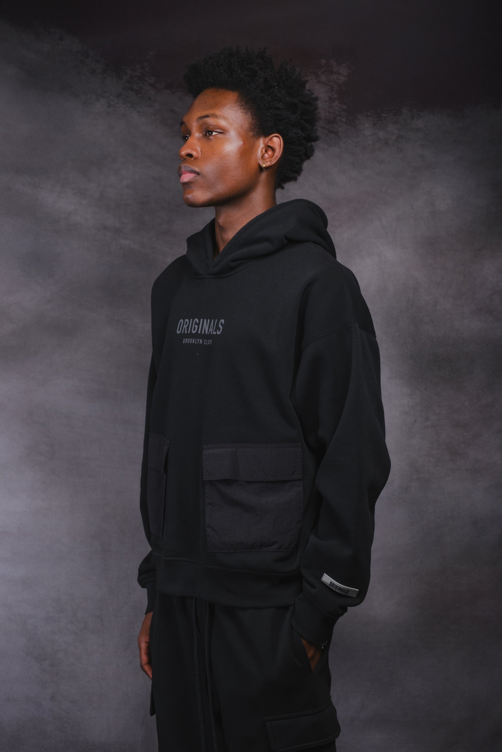 Originals Nylon Cargo Pocket Hoodie. #color_black