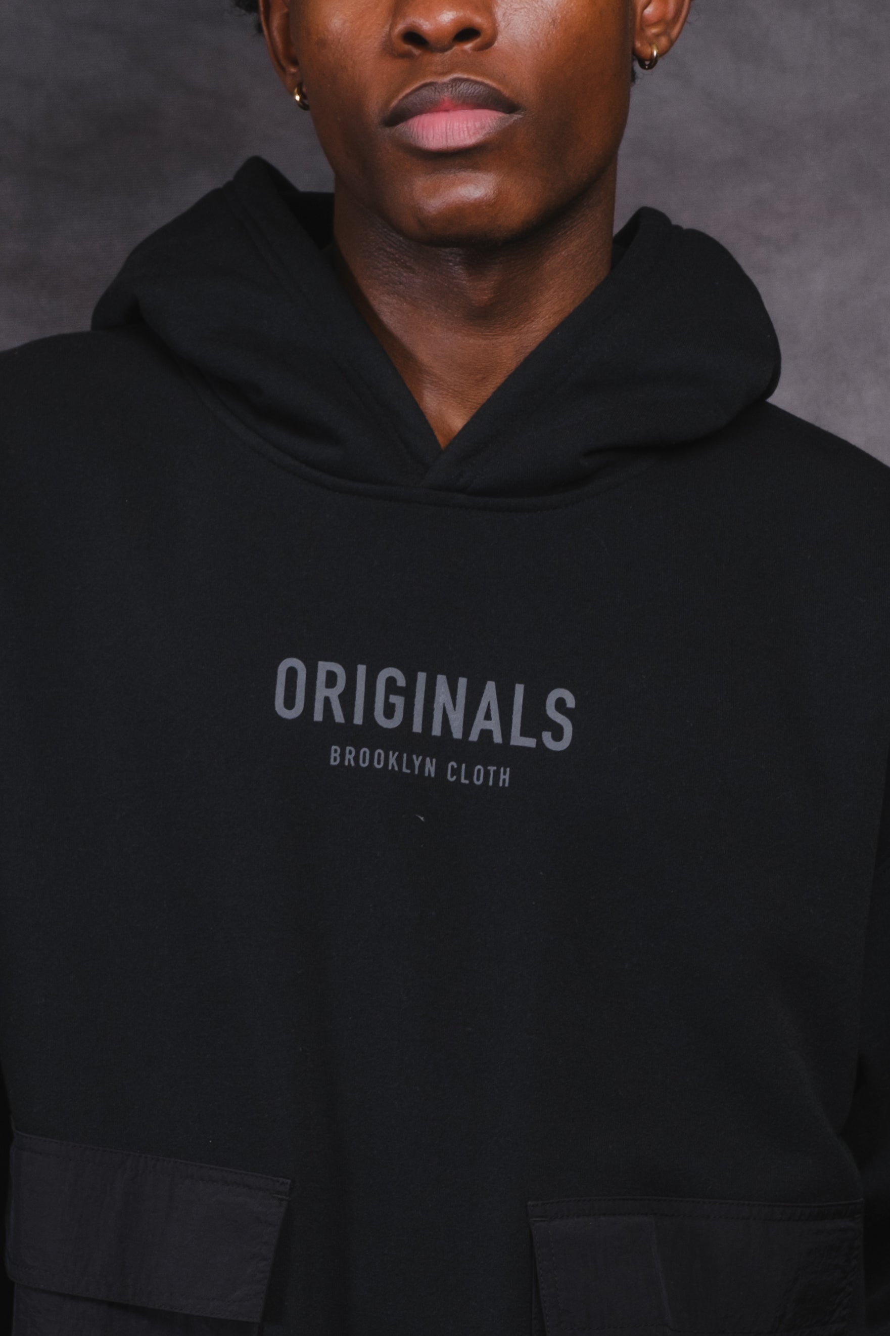 Originals Nylon Cargo Pocket Hoodie. #color_black