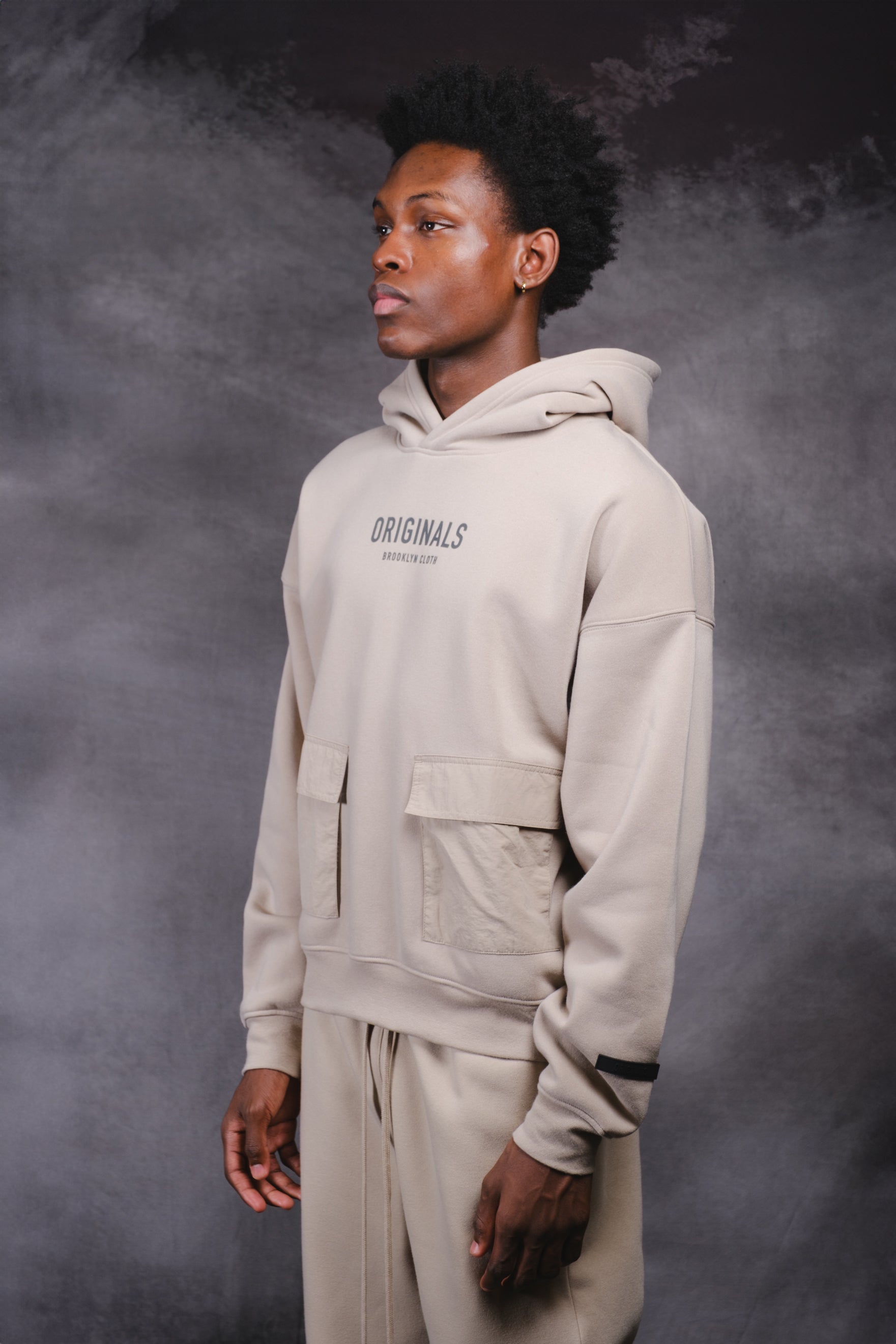 Originals Nylon Cargo Pocket Hoodie. #color_pumice stone