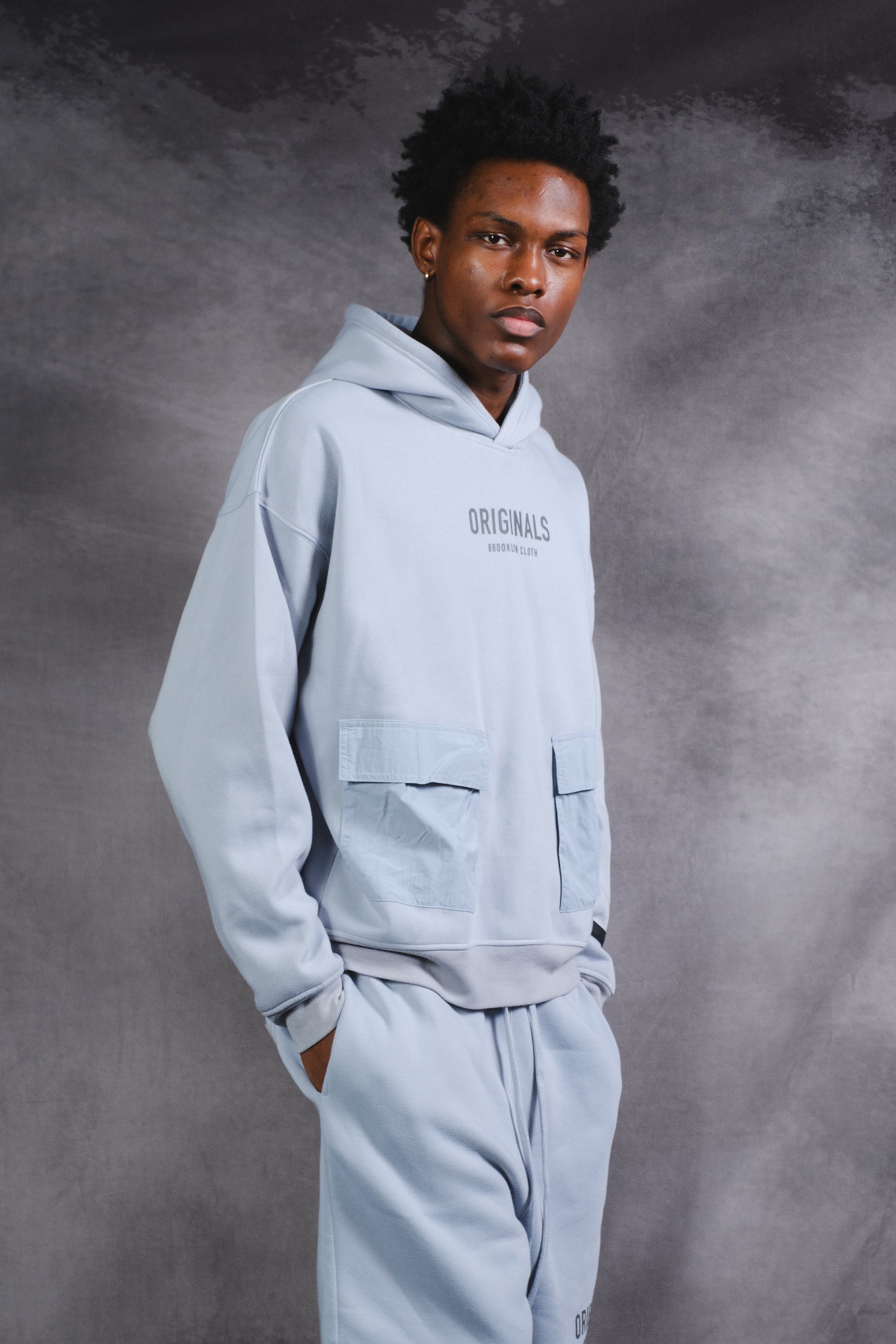 Originals Nylon Cargo Pocket Hoodie. #color_quarry