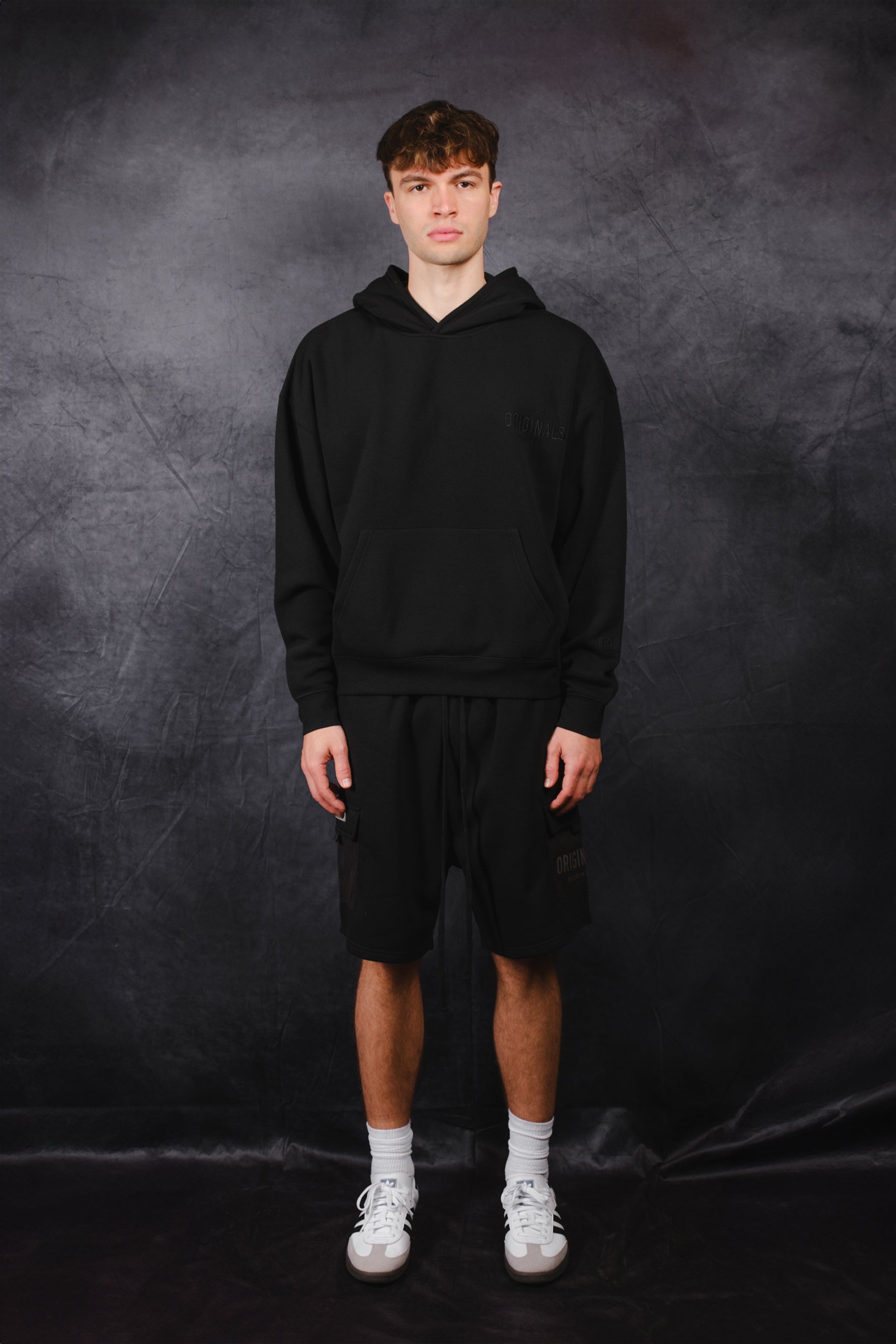 Casual oversized hoodie with tonal embroidery on chest
 #color_black
