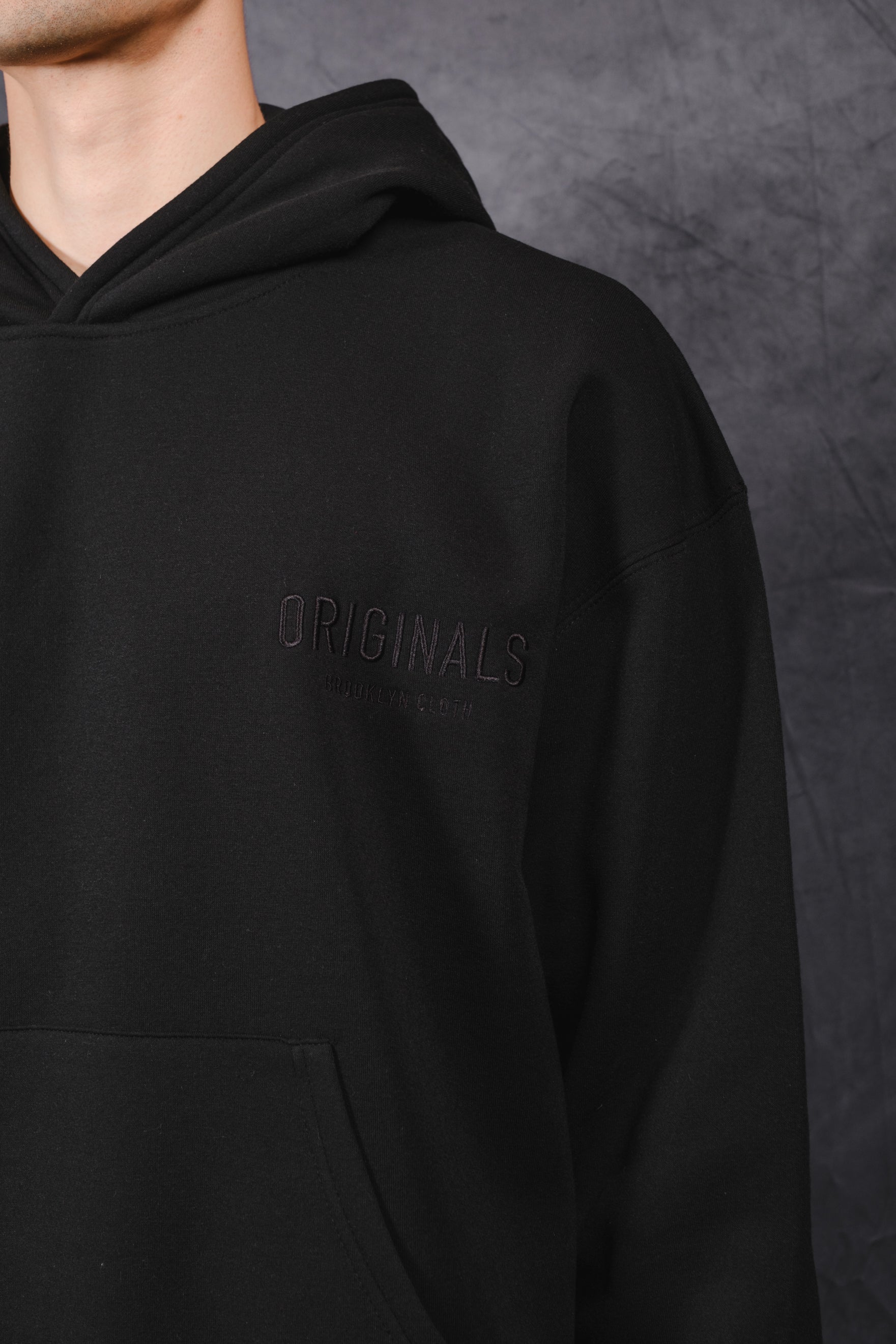 Casual oversized hoodie with tonal embroidery on chest
 #color_black