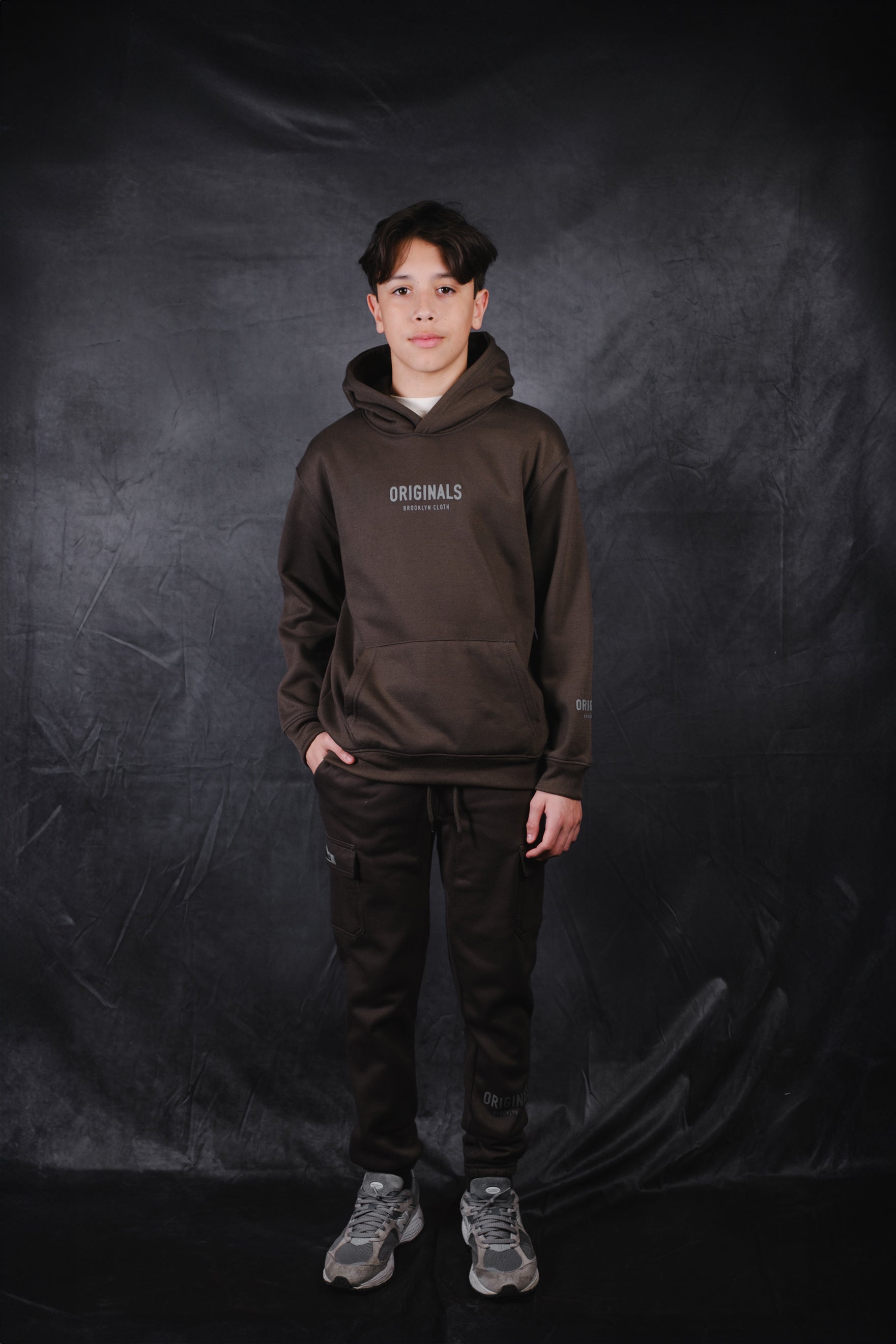 Children's pullover hoodie with signature Originals chest logo.
#color_dusty-black