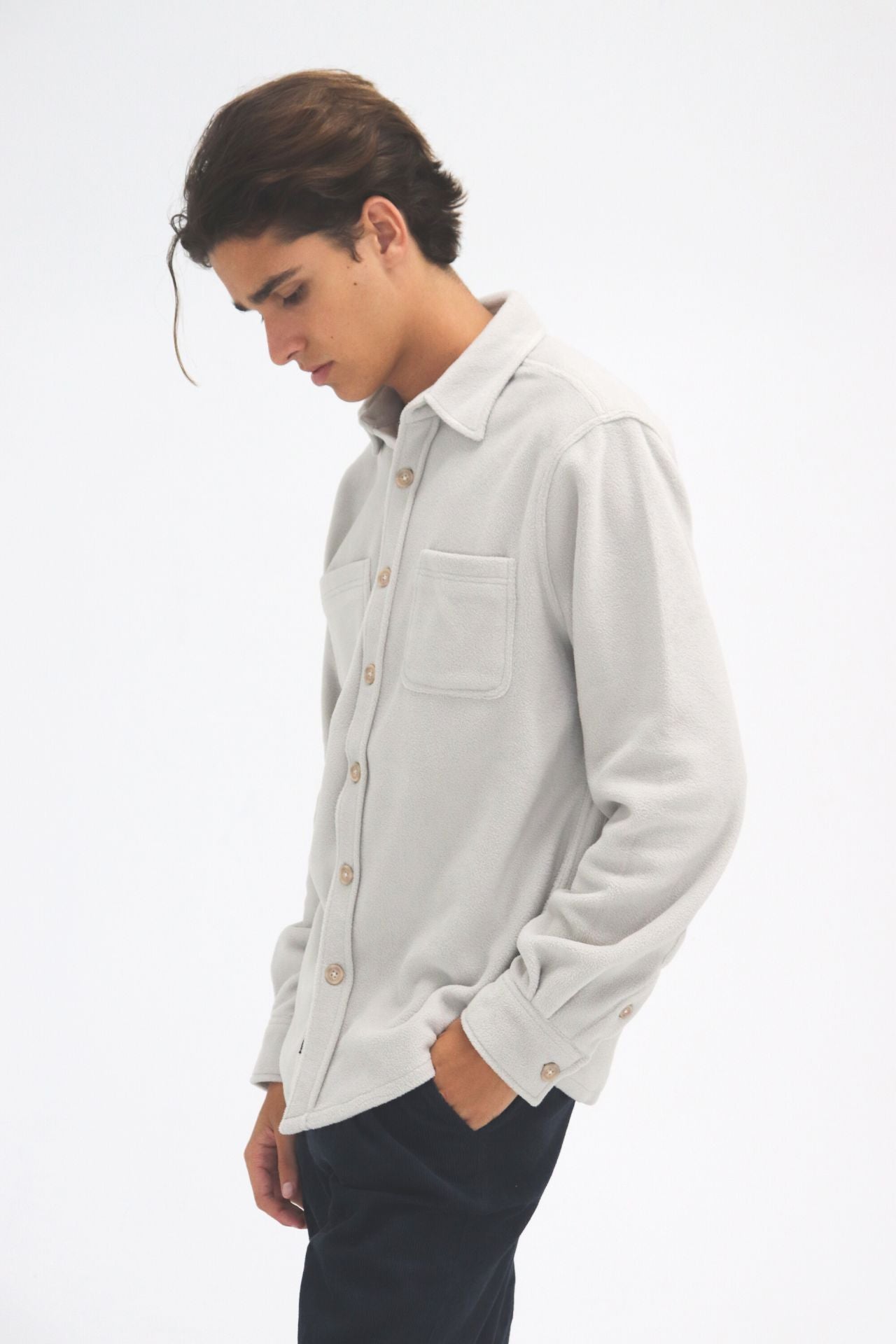 Soft heavy knit shacket with classic button-up style.
#color_light-grey