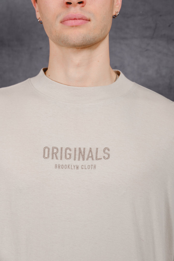 Tonal Embroidered Originals Long Sleeve Tee in soft cotton
#color_pumice-stone