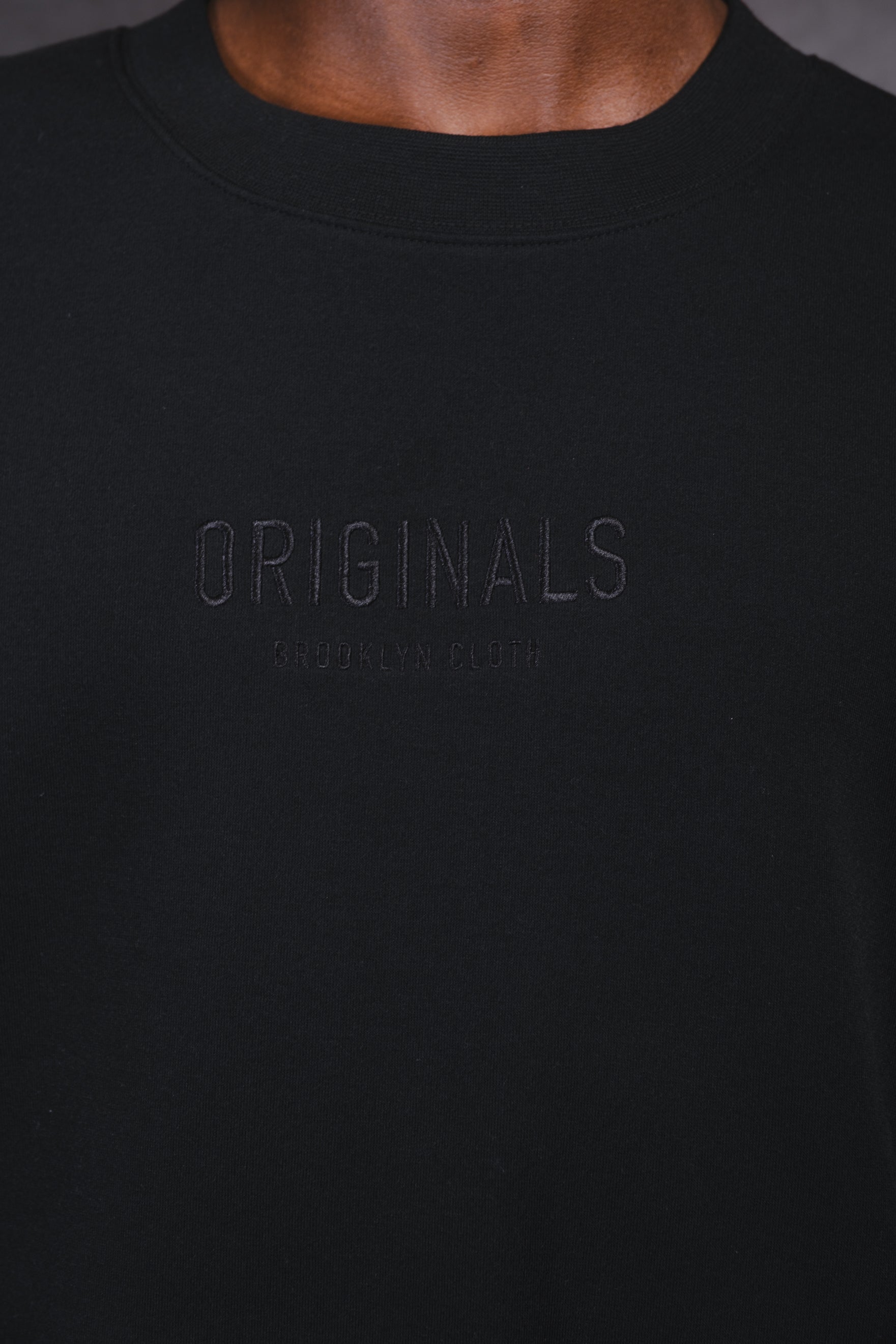 Comfortable fleece crew neck with tonal embroidery by Brooklyn Cloth
#color_black