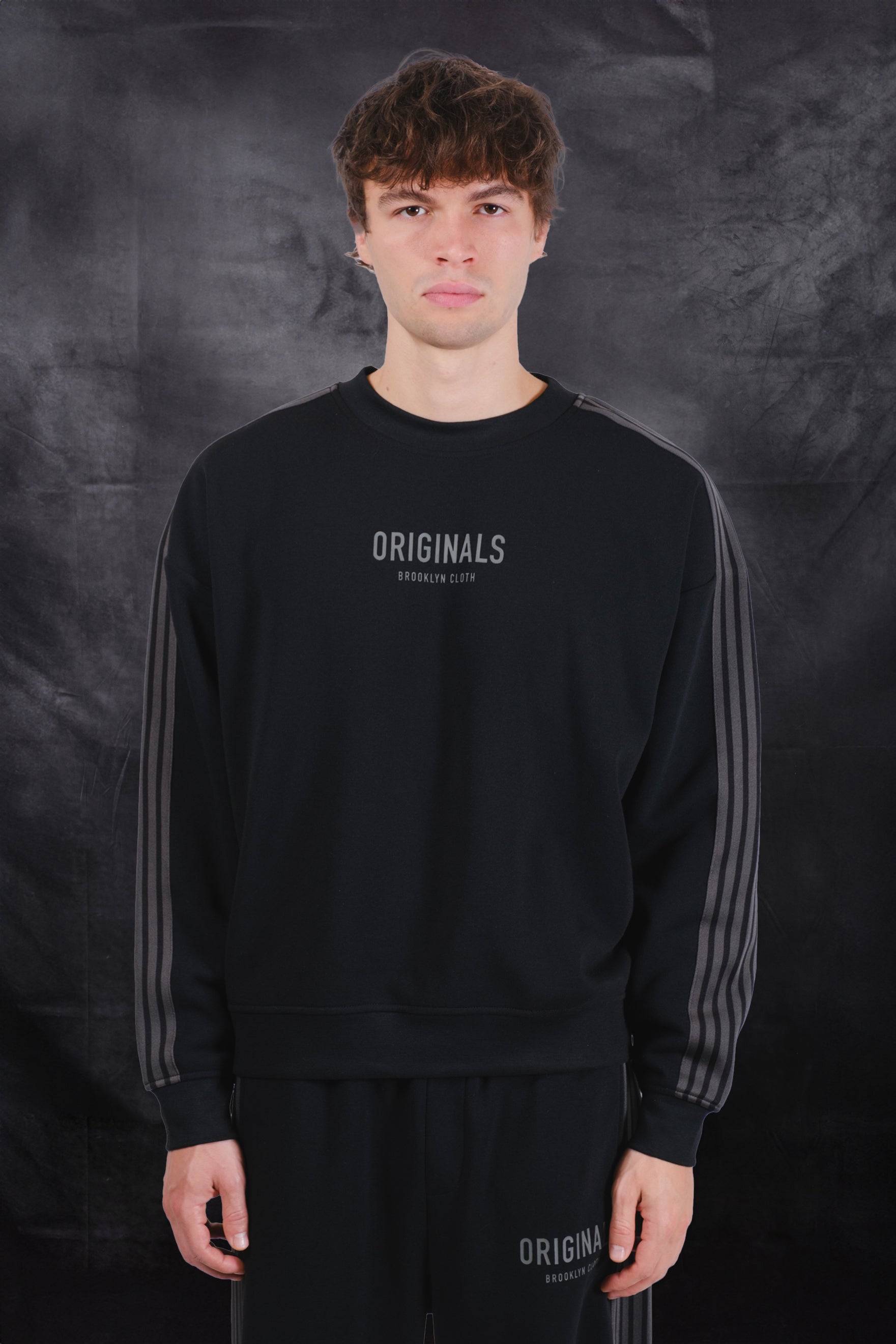 High quality men's track sweatshirt with crewneck line and lettering on center #color_black