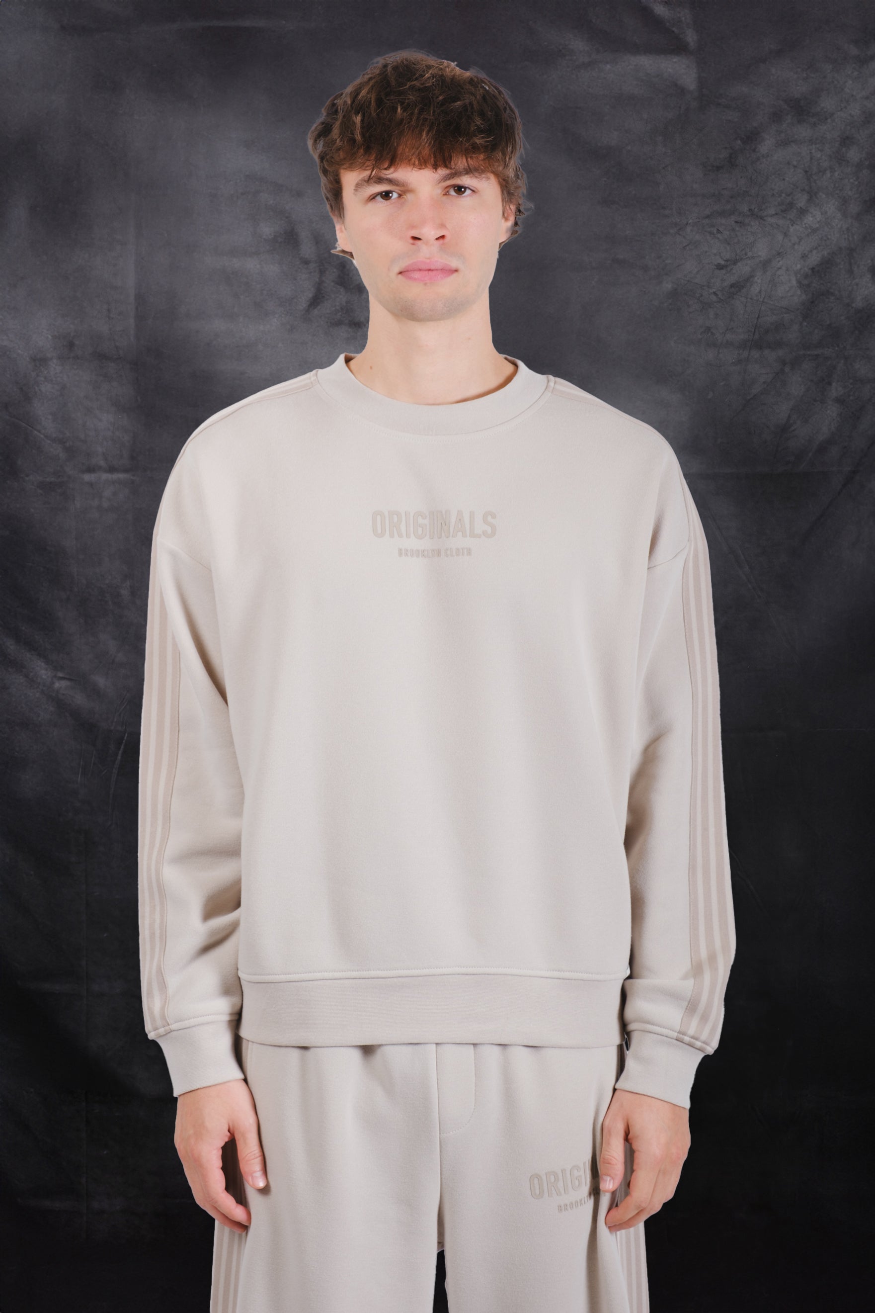 Men's sand track sweatshirt with lettering on center #color_sand
