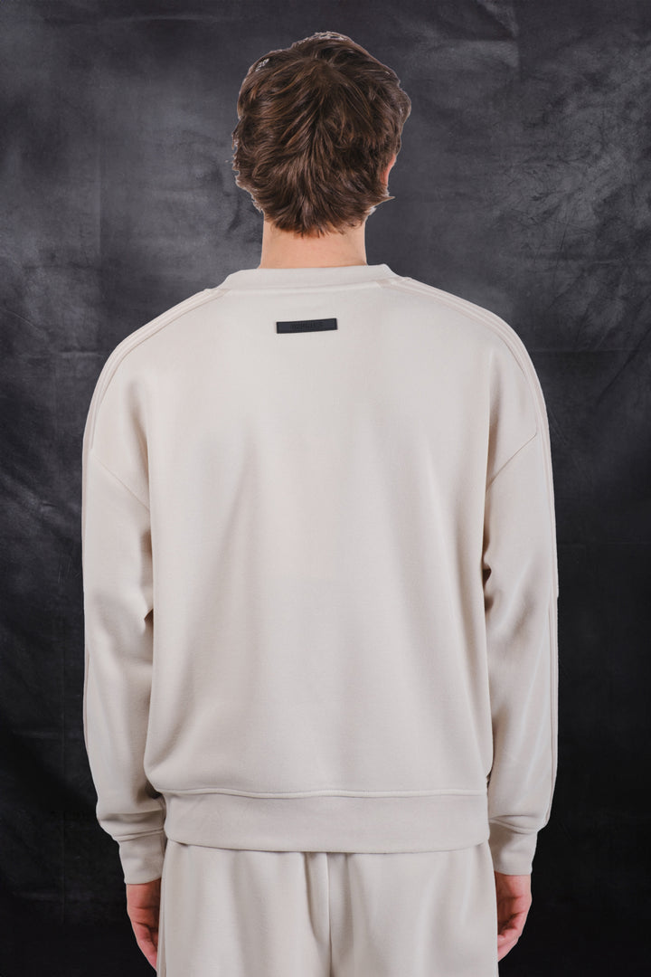 Sand crewneck sweatshirt with rubber patch on back #color_sand
