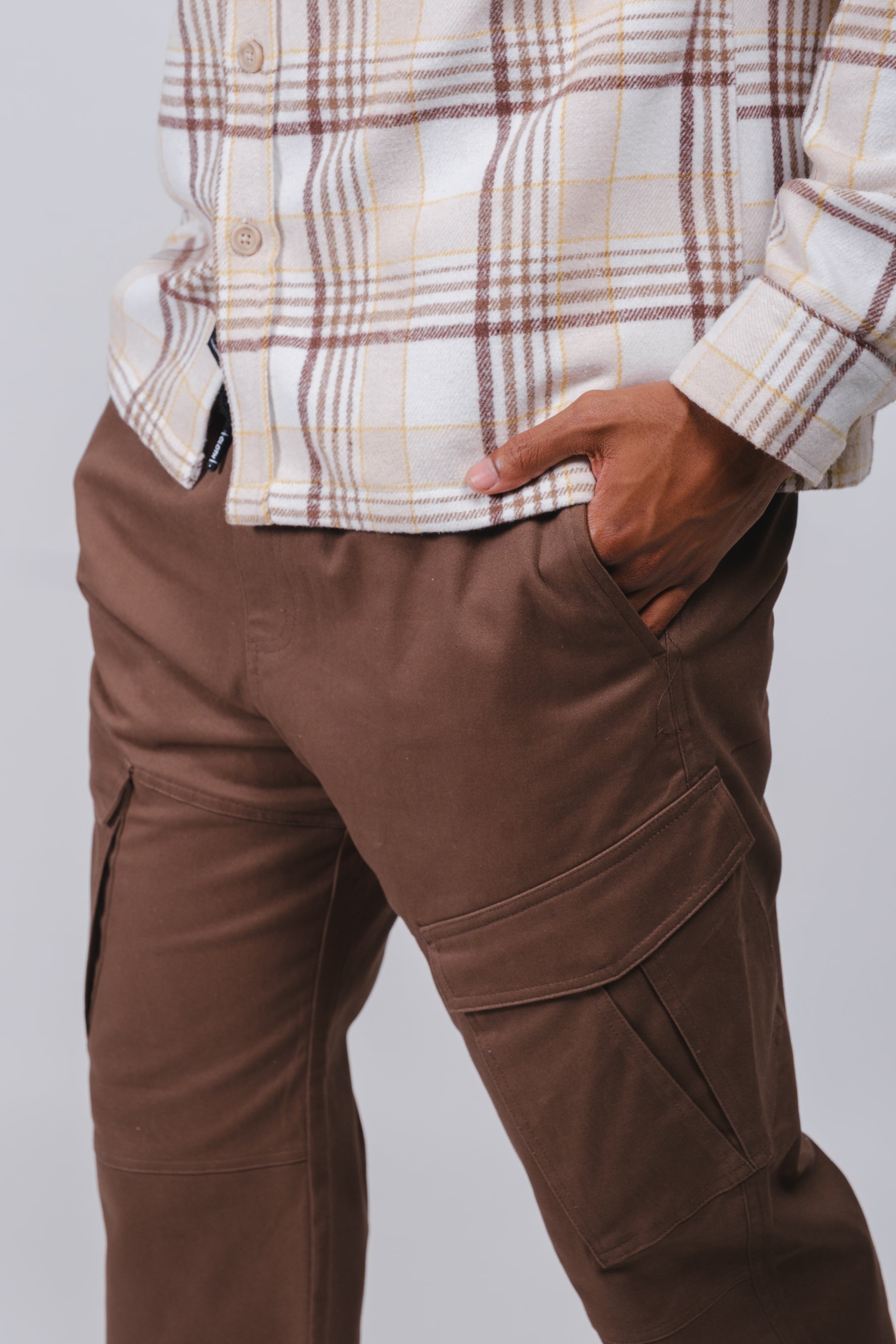 Durable men's twill pants with tapered legs and cargo pocket detail
#color_brown