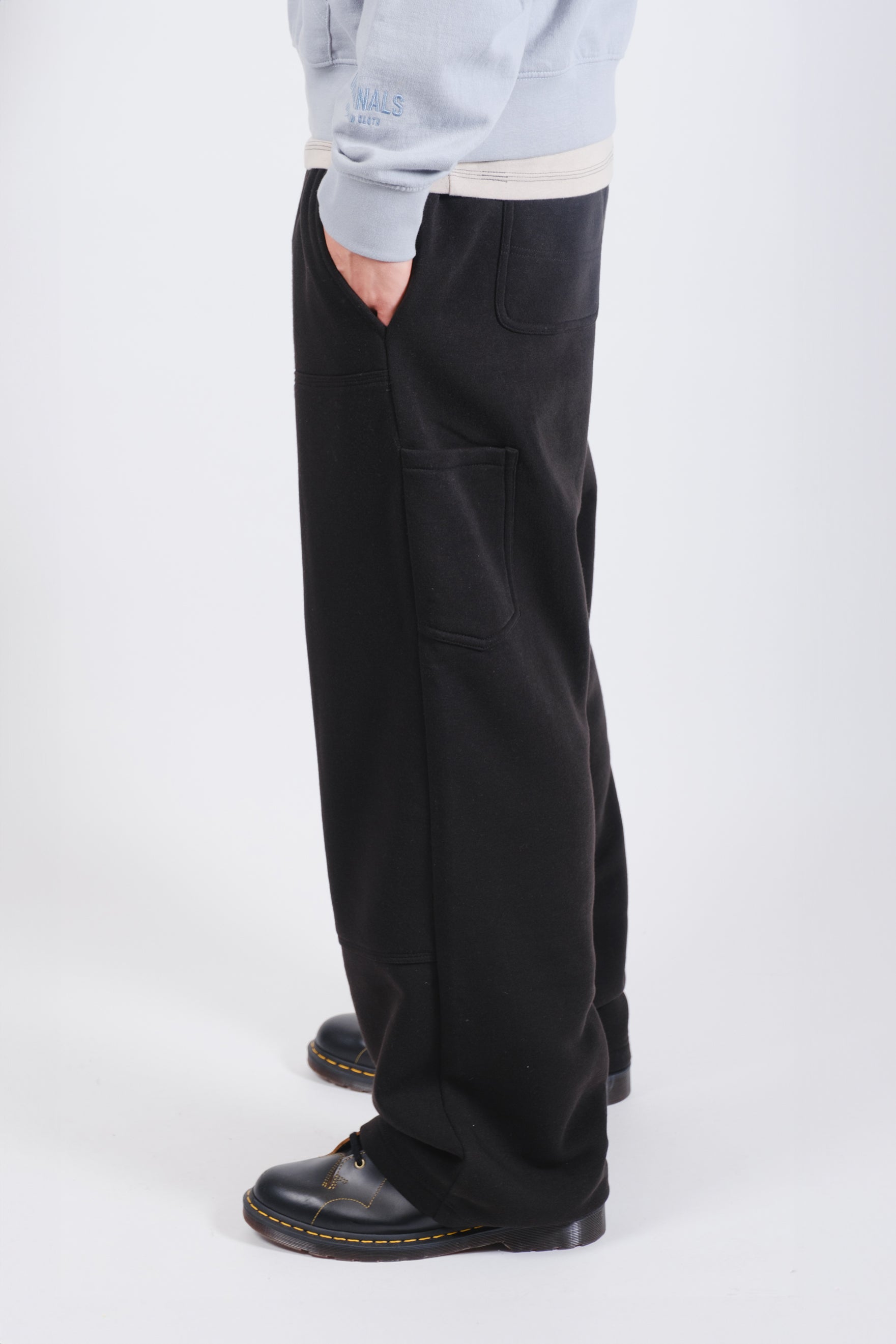 Men's fleece carpenter pants, combining comfort with versatile storage options
#color_black