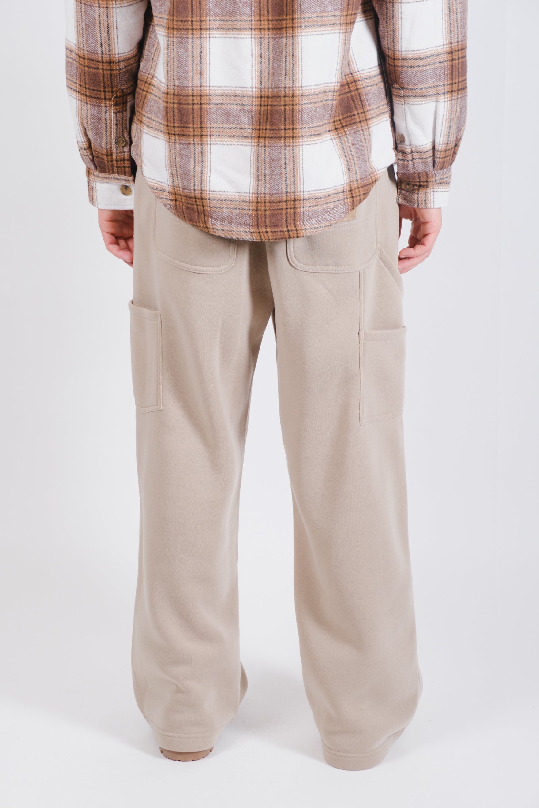 Poly fleece carpenter pants with relaxed fit and convenient side pockets
#color_pumice stone