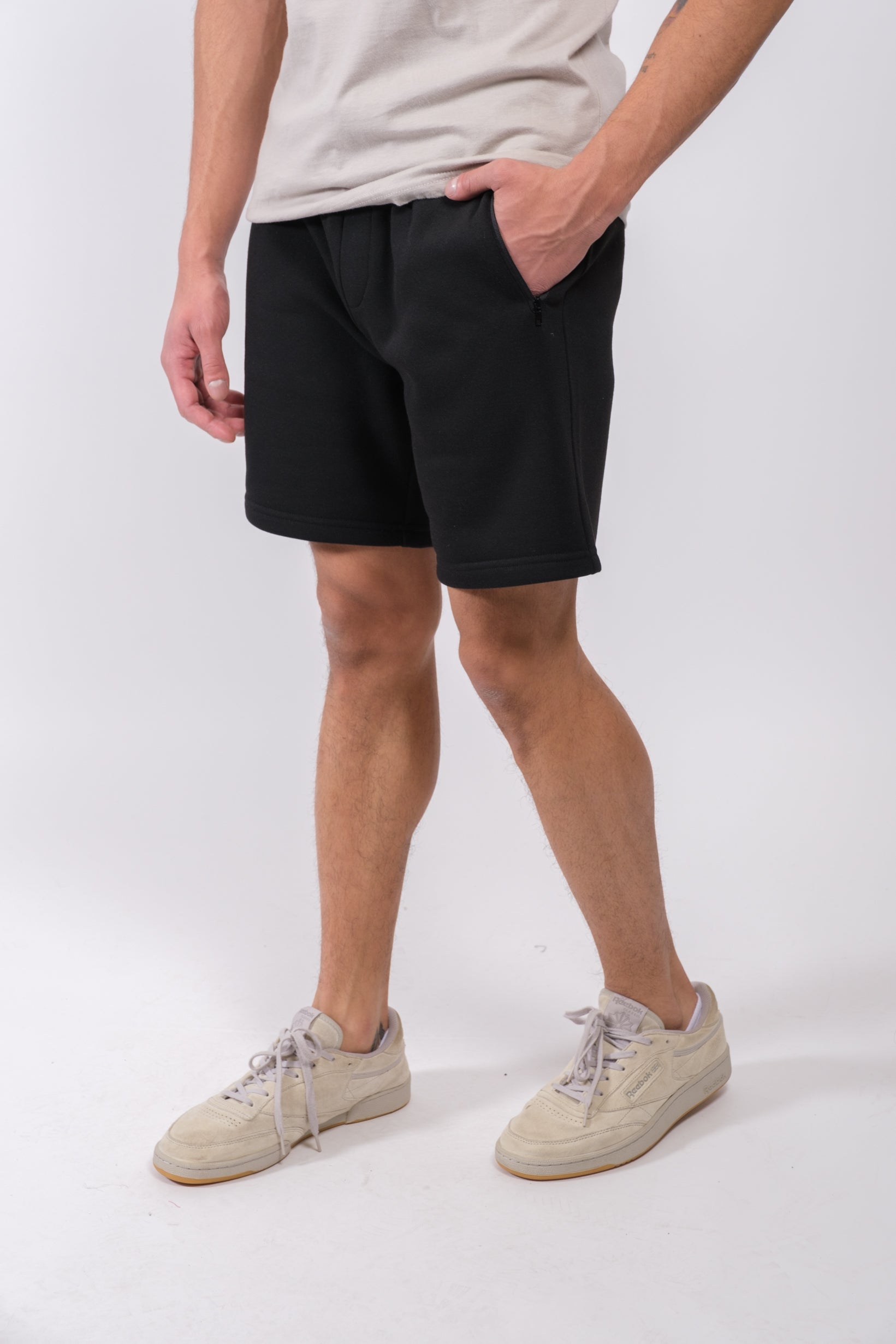 Durable 7 inch inseam fleece shorts for men with functional zip pocket
#color_black