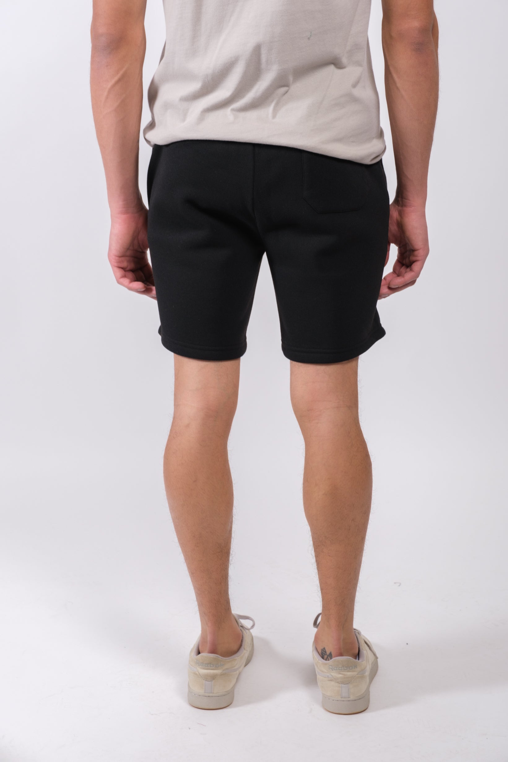Stylish men's 7 inch fleece shorts with relaxed fit and zip pocket
#color_black