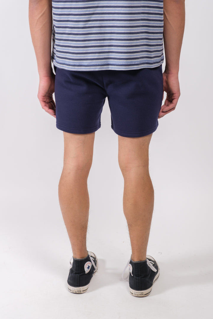 Stylish men's shorts with heat seal zip pocket and 5-inch length
#color_french-navy