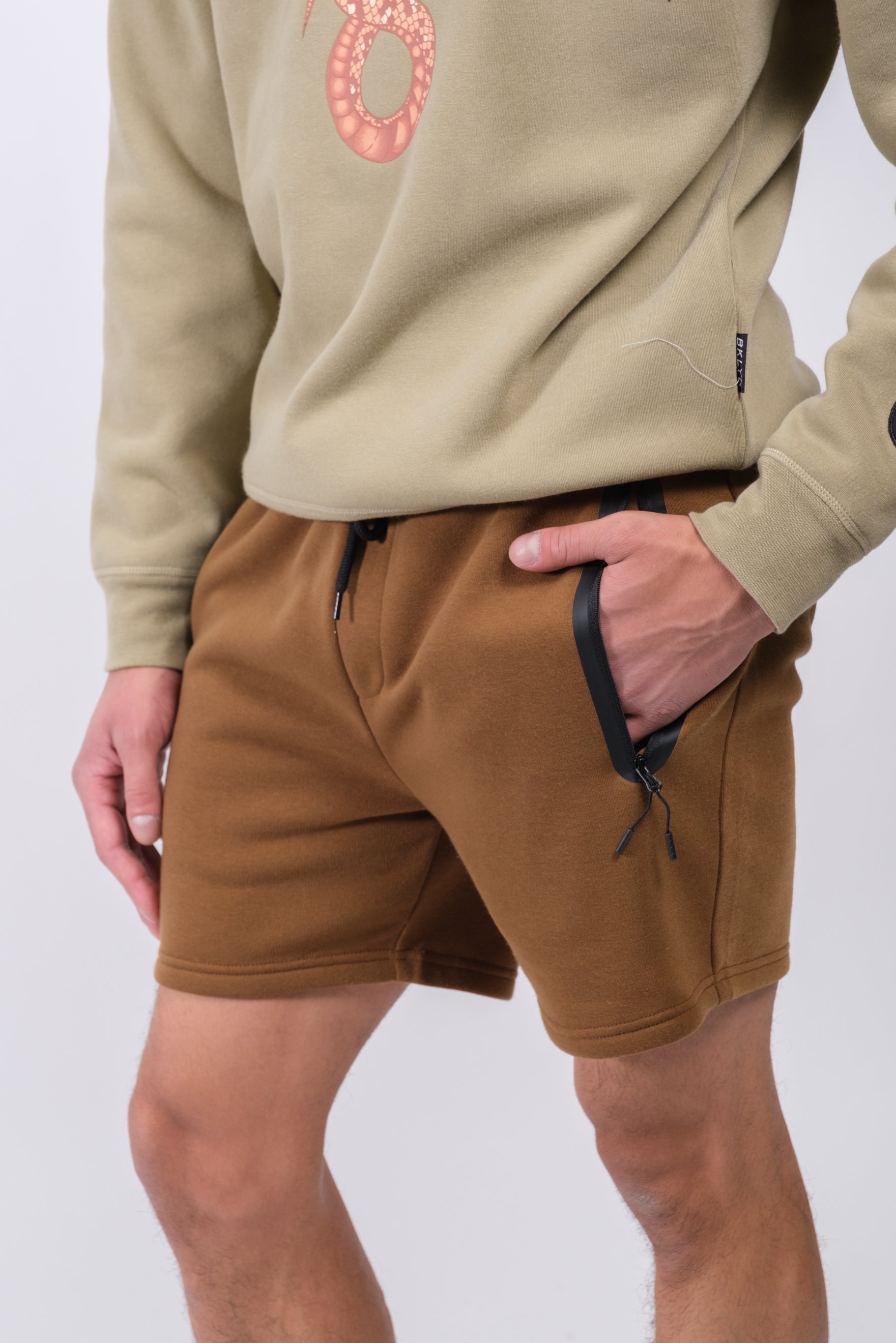 Men's versatile Heat Seal Zip Pocket Short with 5 inch inseam
#color_toffee