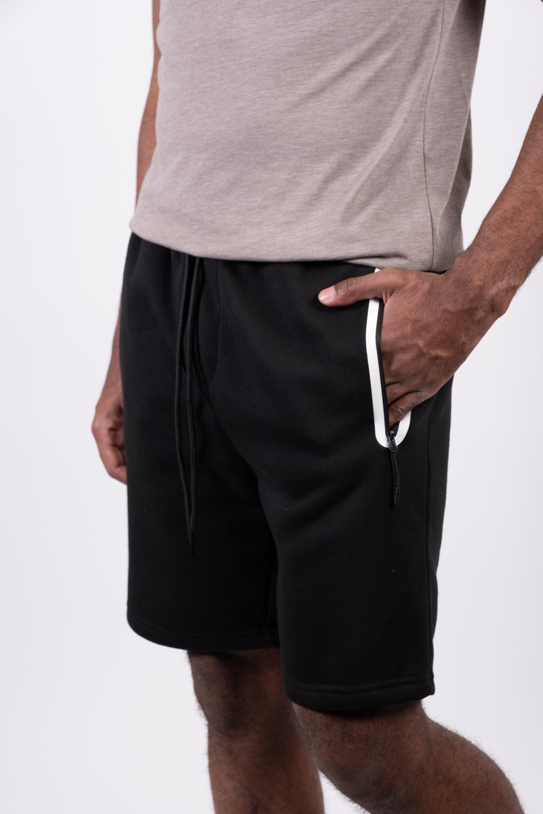 Stylish men's shorts with heat sealed zip pockets and flexible waistband
#color_black and white