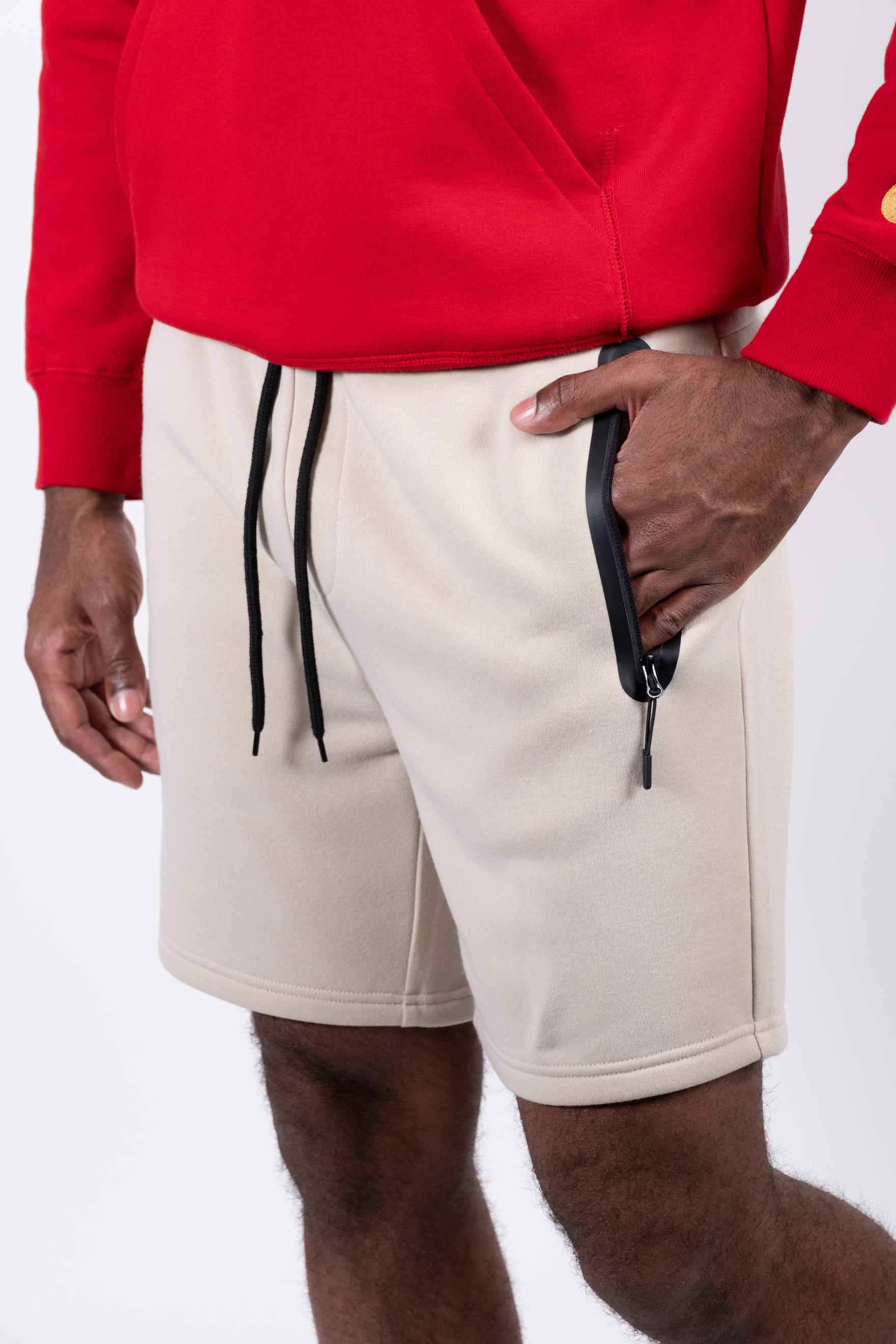 Men's shorts featuring heat-sealed zip pockets and comfortable fit
#color_sand