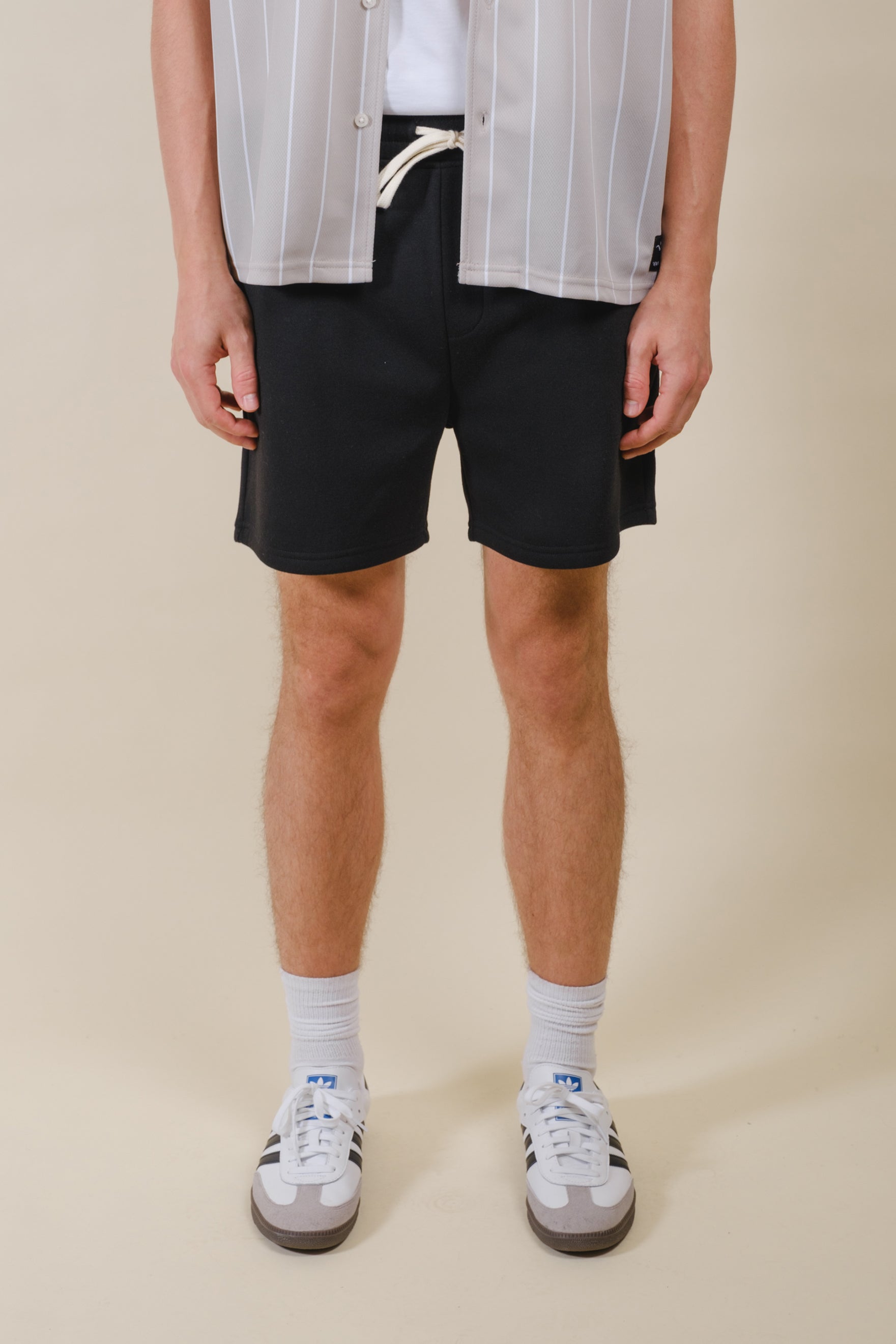 Men's 5 inch inseam fleece shorts with soft material and drawstring
#color_black