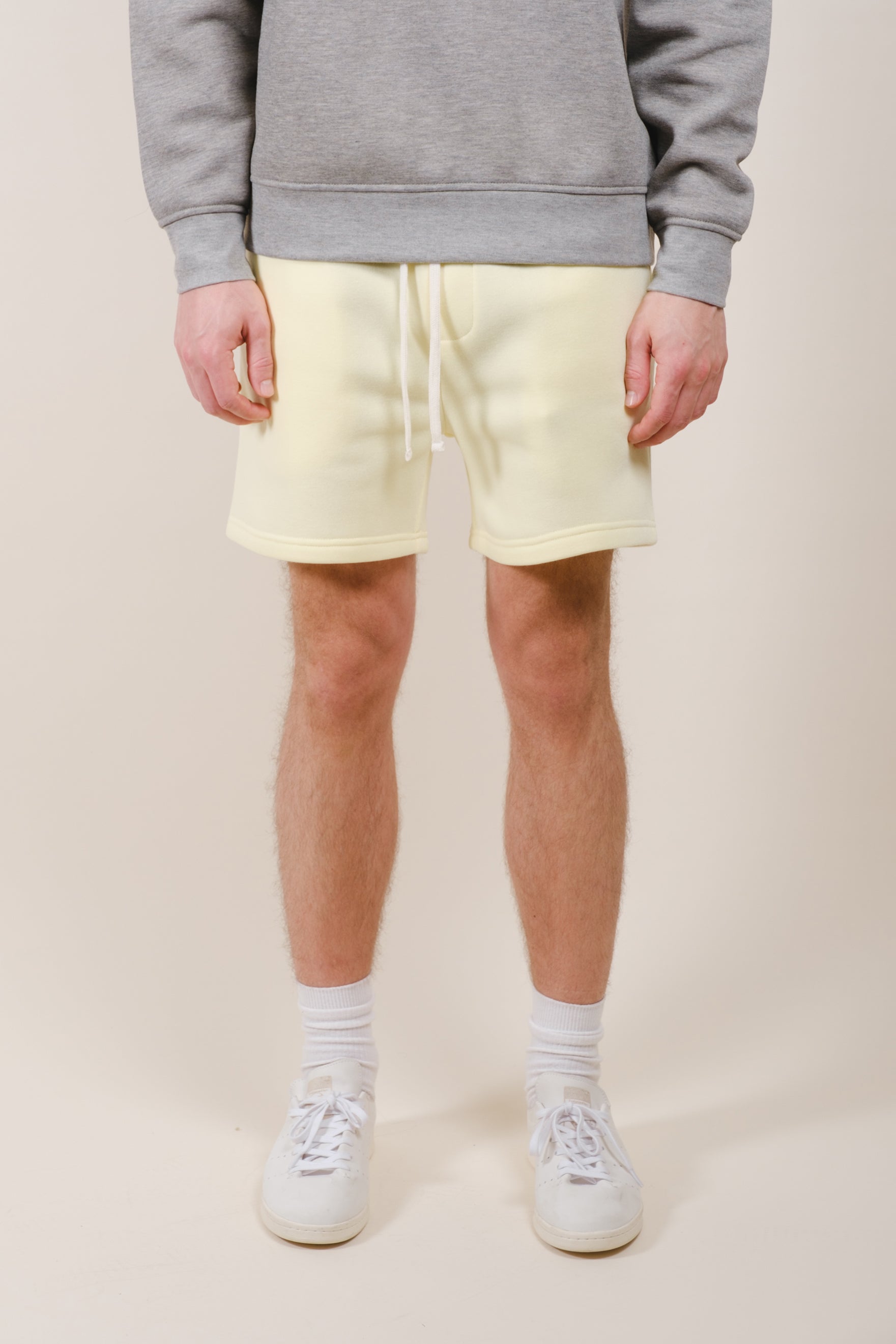 Men's 5 inch inseam fleece shorts with adjustable waist and back pocket
#color_pastel yellow