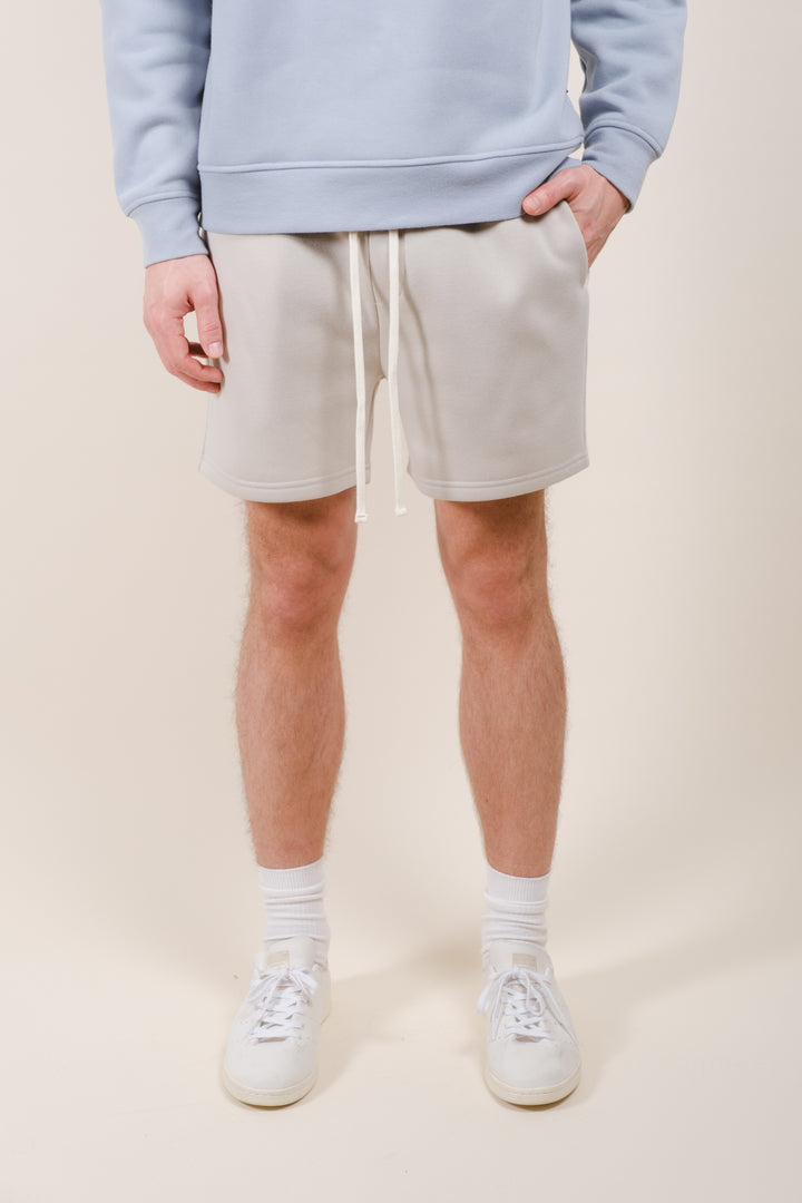 Men's casual fleece shorts featuring a 5-inch inseam and back pocket
#color_sand