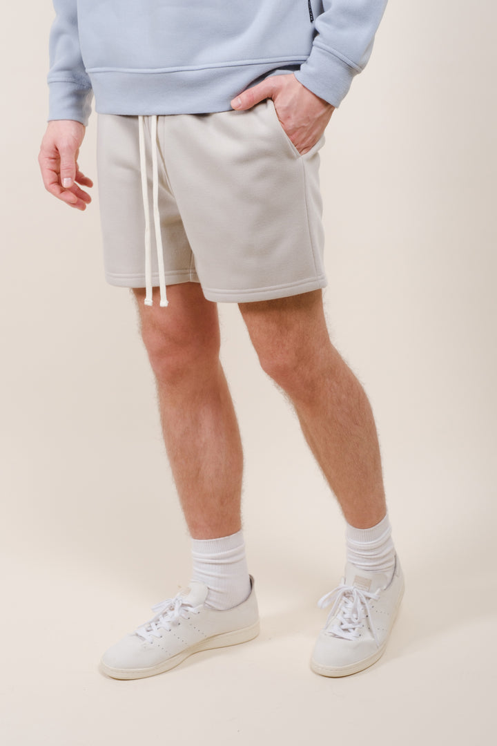 Soft 5-inch Core Fleece Shorts for men with elastic waist design
#color_sand