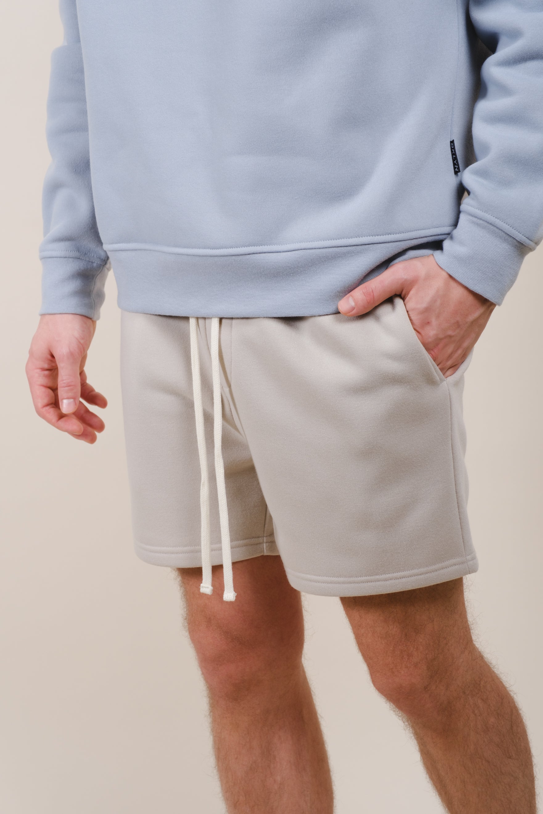 Men's fleece shorts with a 5 inch inseam and comfortable back pocket
#color_sand