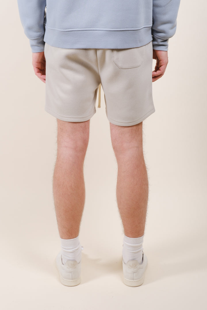 5-inch inseam fleece shorts for men with drawstring waist and back pocket
#color_sand