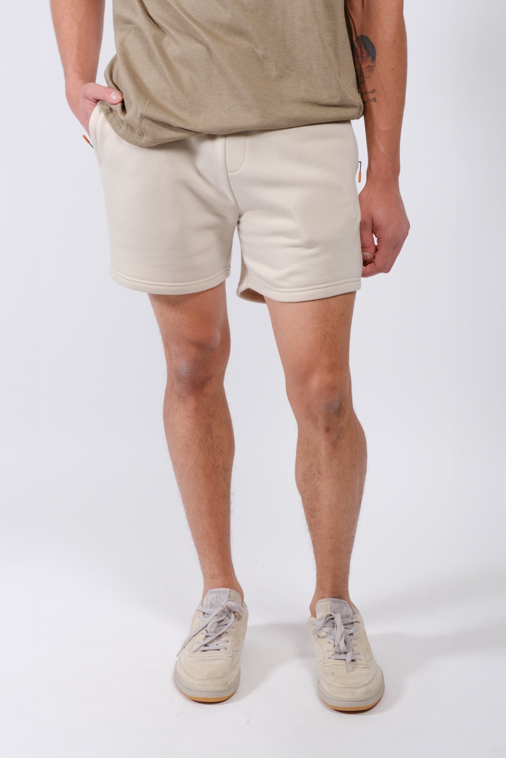 Men’s 5 inseam fleece shorts with secure zip pocket by Brooklyn Cloth
#color_sand