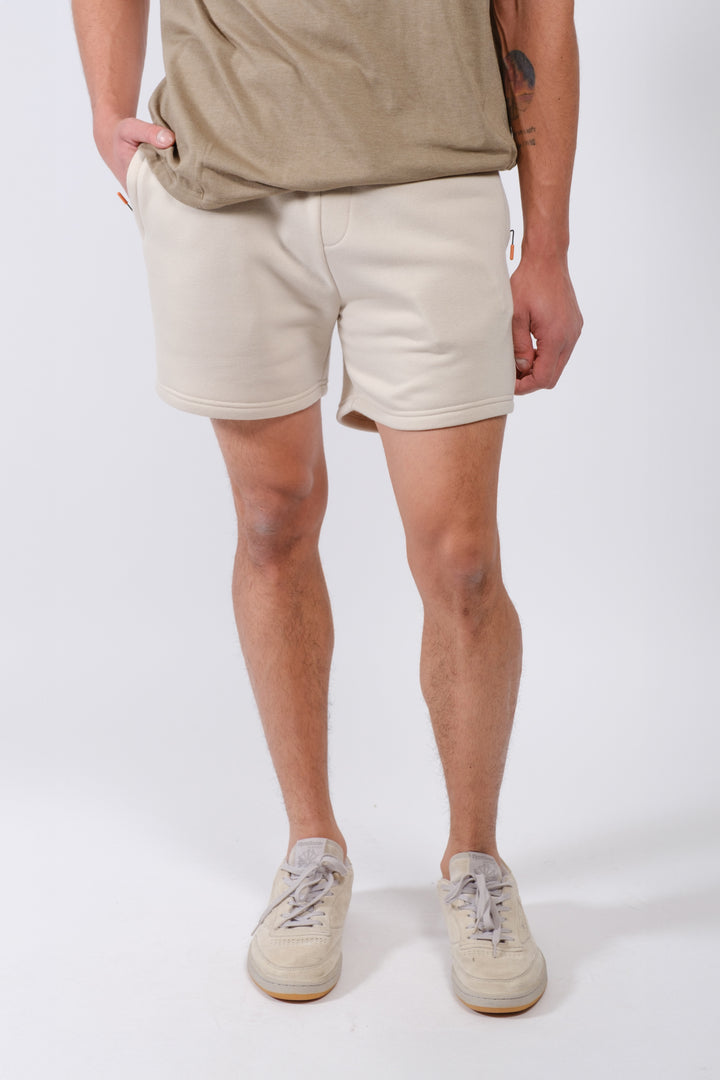 Men’s 5 inseam fleece shorts with secure zip pocket by Brooklyn Cloth
#color_sand