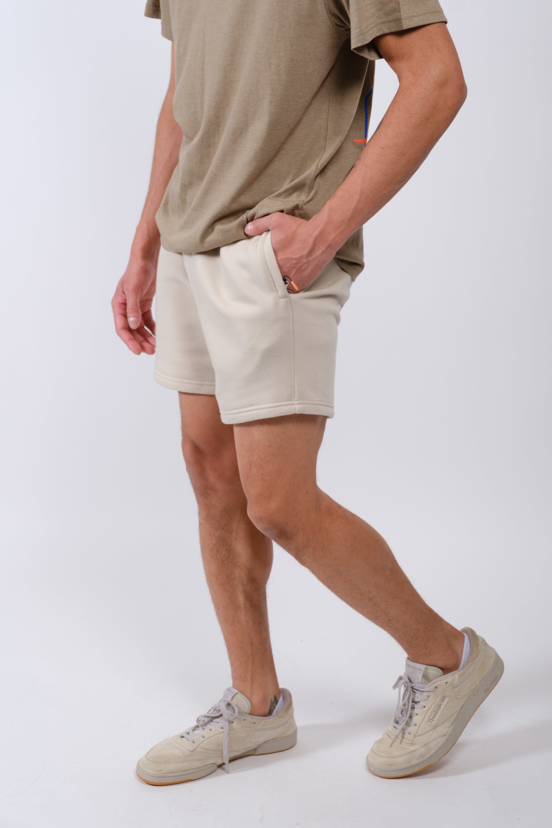 Essential men’s 5-inch inseam fleece shorts with zip pocket by Brooklyn Cloth
#color_sand