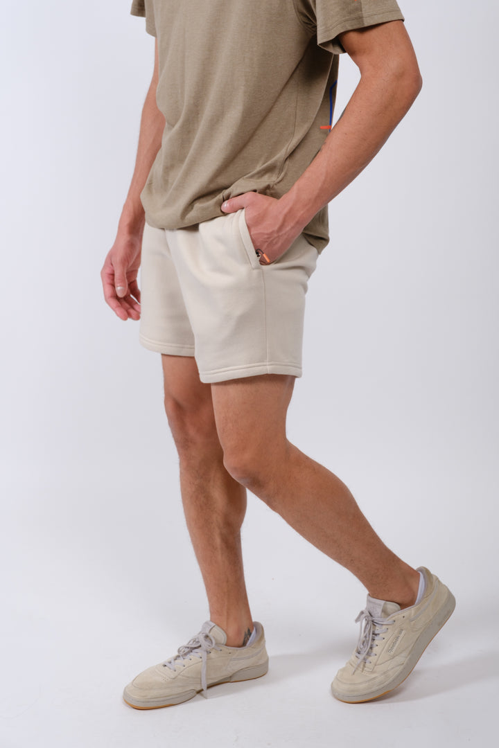 Essential men’s 5-inch inseam fleece shorts with zip pocket by Brooklyn Cloth
#color_sand